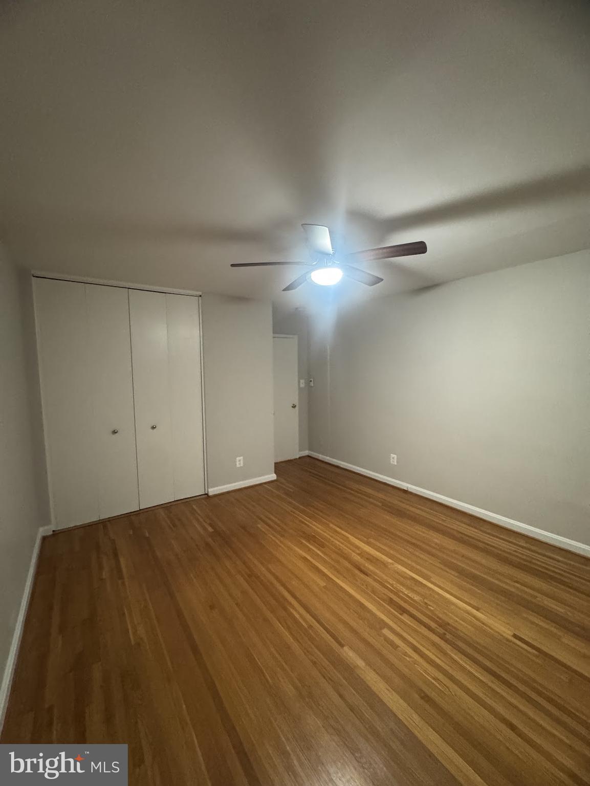 1510 North Rolfe Street, Unit 4 Arlington, VA 22209 - Photo 7 of 9 a view of an empty room and wooden floor