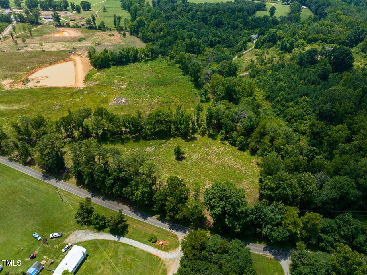 401 Buck Gunter Road Siler City, NC 27344 - Photo 4 of 13 a view of a lake with a yard