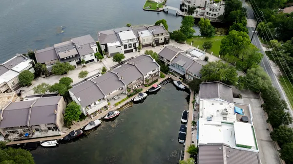 an aerial view of a house with outdoor space and street view