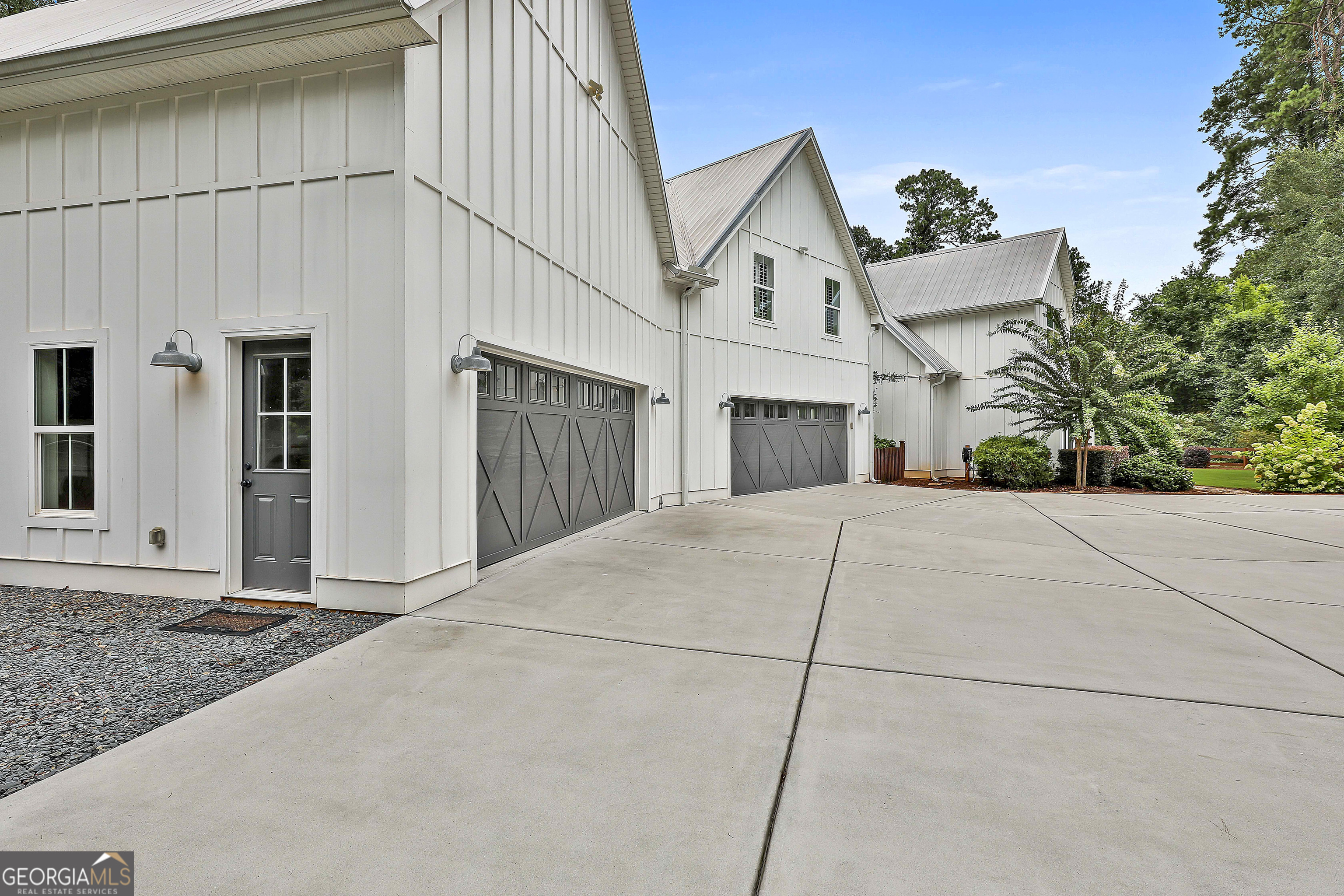 49 Standing Rock Road Senoia, GA 30276 - Photo 14 of 92 a view of white house with a small yard and large tree