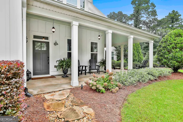 a kitchen with stainless steel appliances kitchen island granite countertop a sink stove and refrigerator