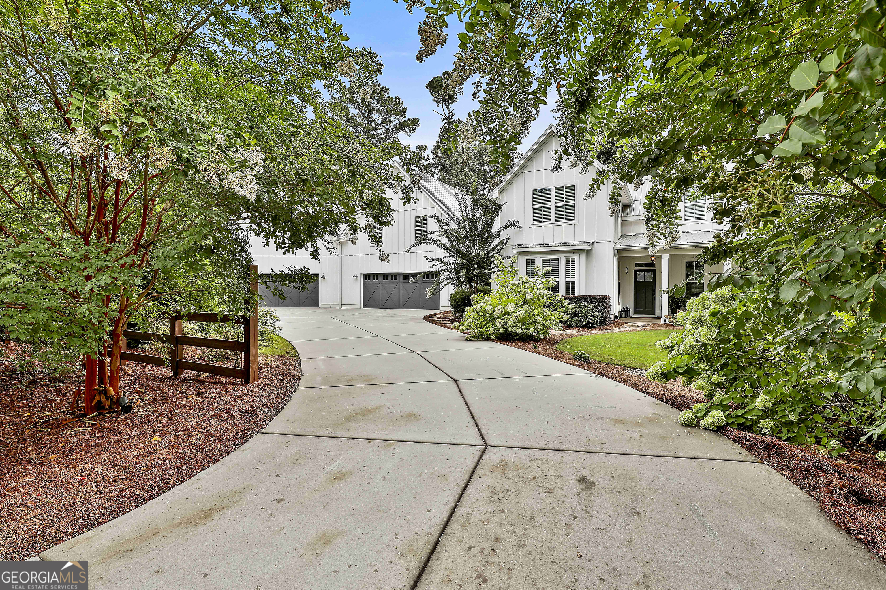 49 Standing Rock Road Senoia, GA 30276 - Photo 2 of 92 a house with trees in the background