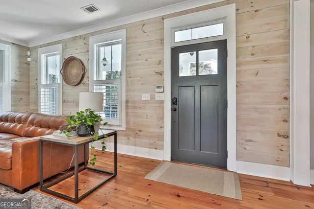 a view of a dining room with furniture window and wooden floor