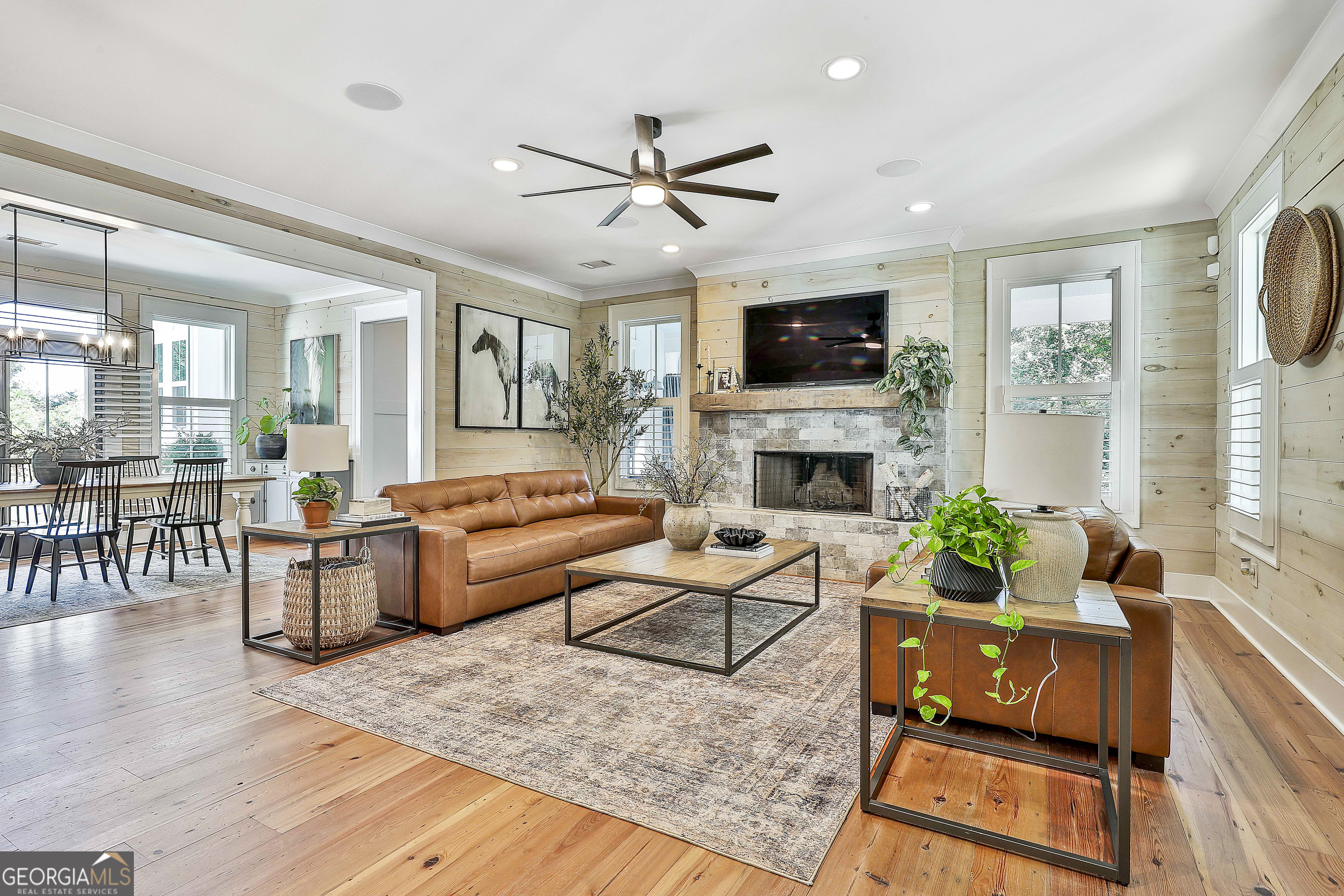 49 Standing Rock Road Senoia, GA 30276 - Photo 24 of 92 a living room with furniture fireplace and flat screen tv