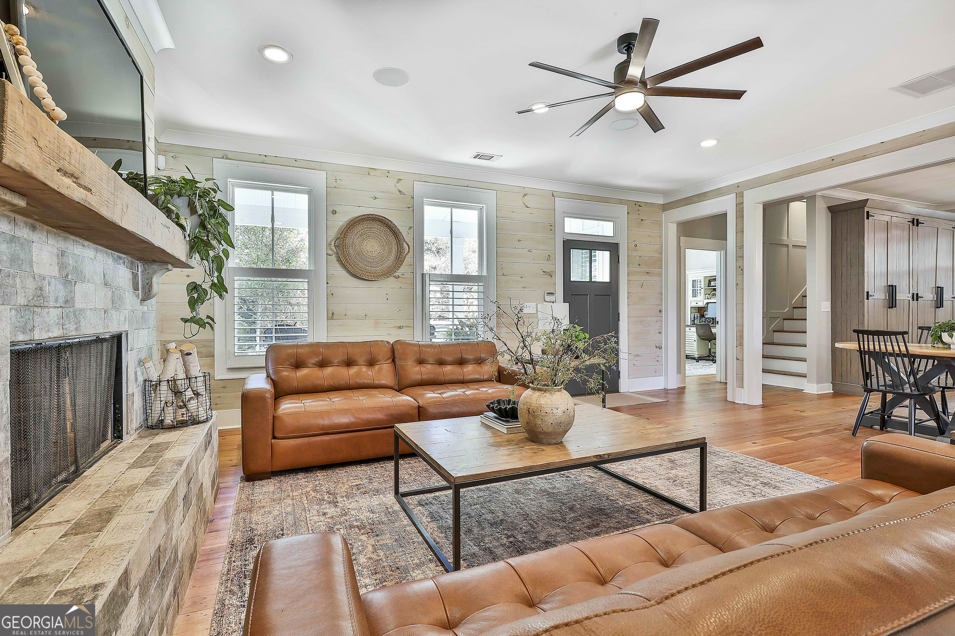 49 Standing Rock Road Senoia, GA 30276 - Photo 27 of 92 a living room with furniture and a fireplace