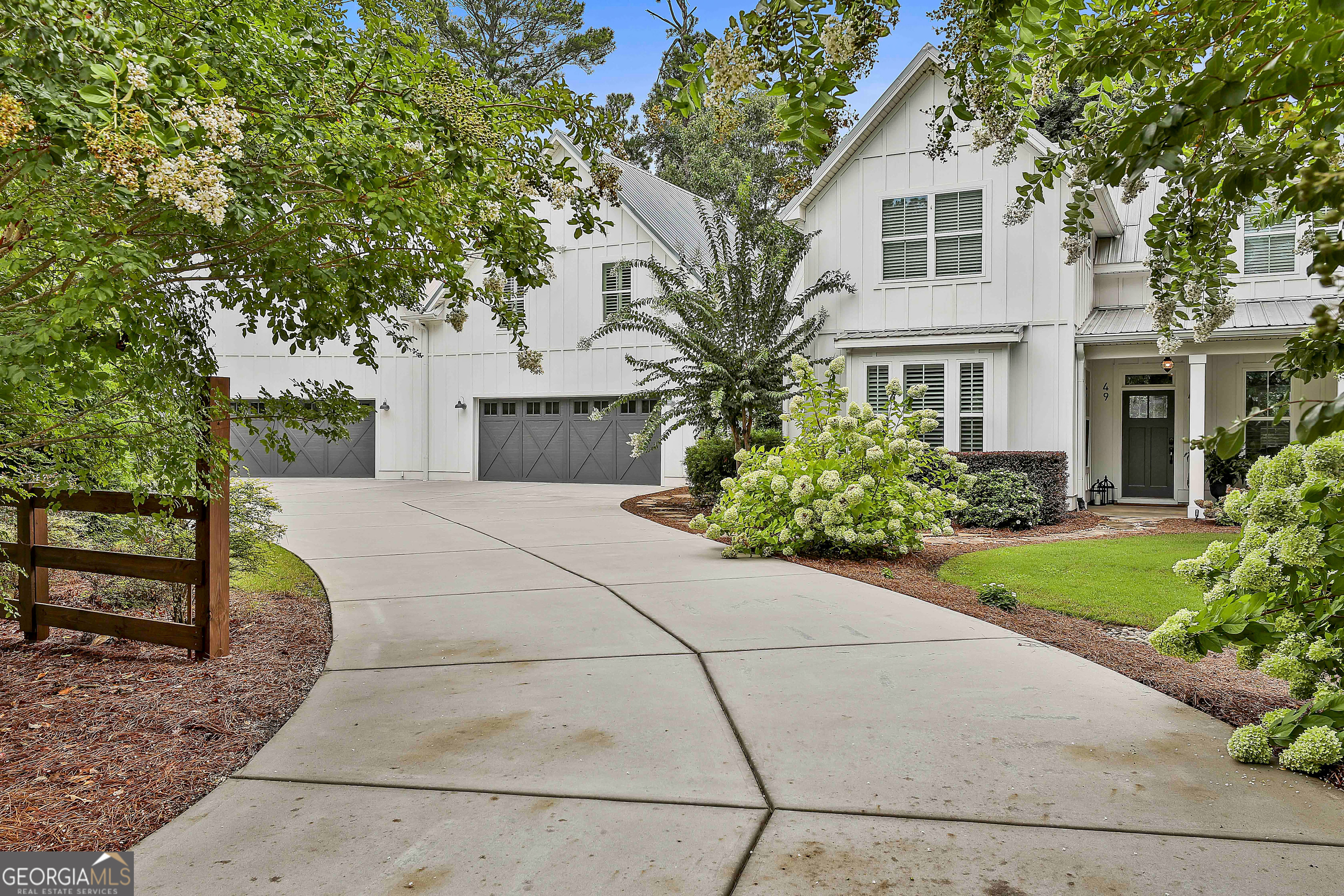 49 Standing Rock Road Senoia, GA 30276 - Photo 3 of 92 a front view of a house with garden