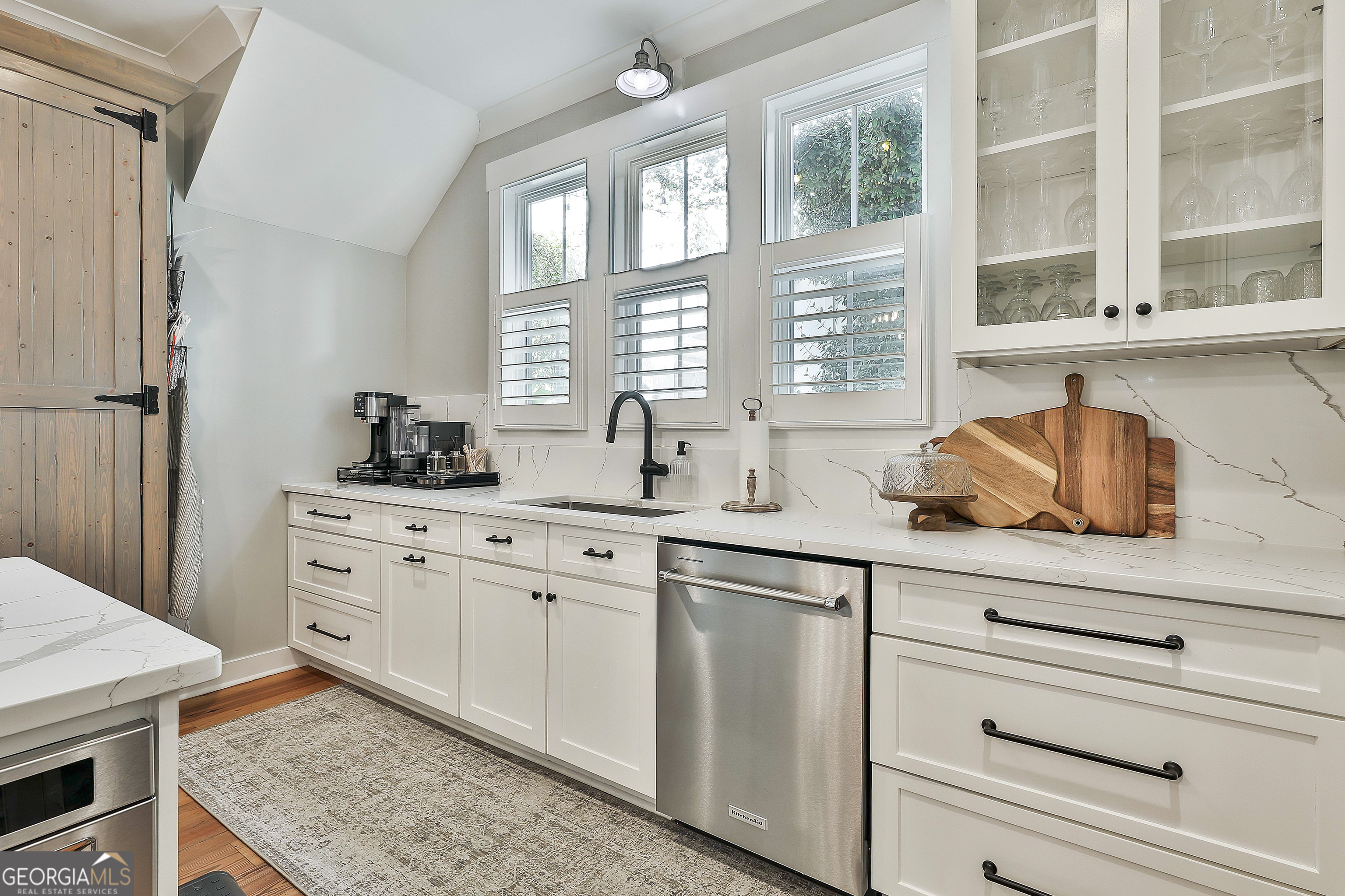 49 Standing Rock Road Senoia, GA 30276 - Photo 34 of 92 a kitchen with cabinets appliances a sink and a window