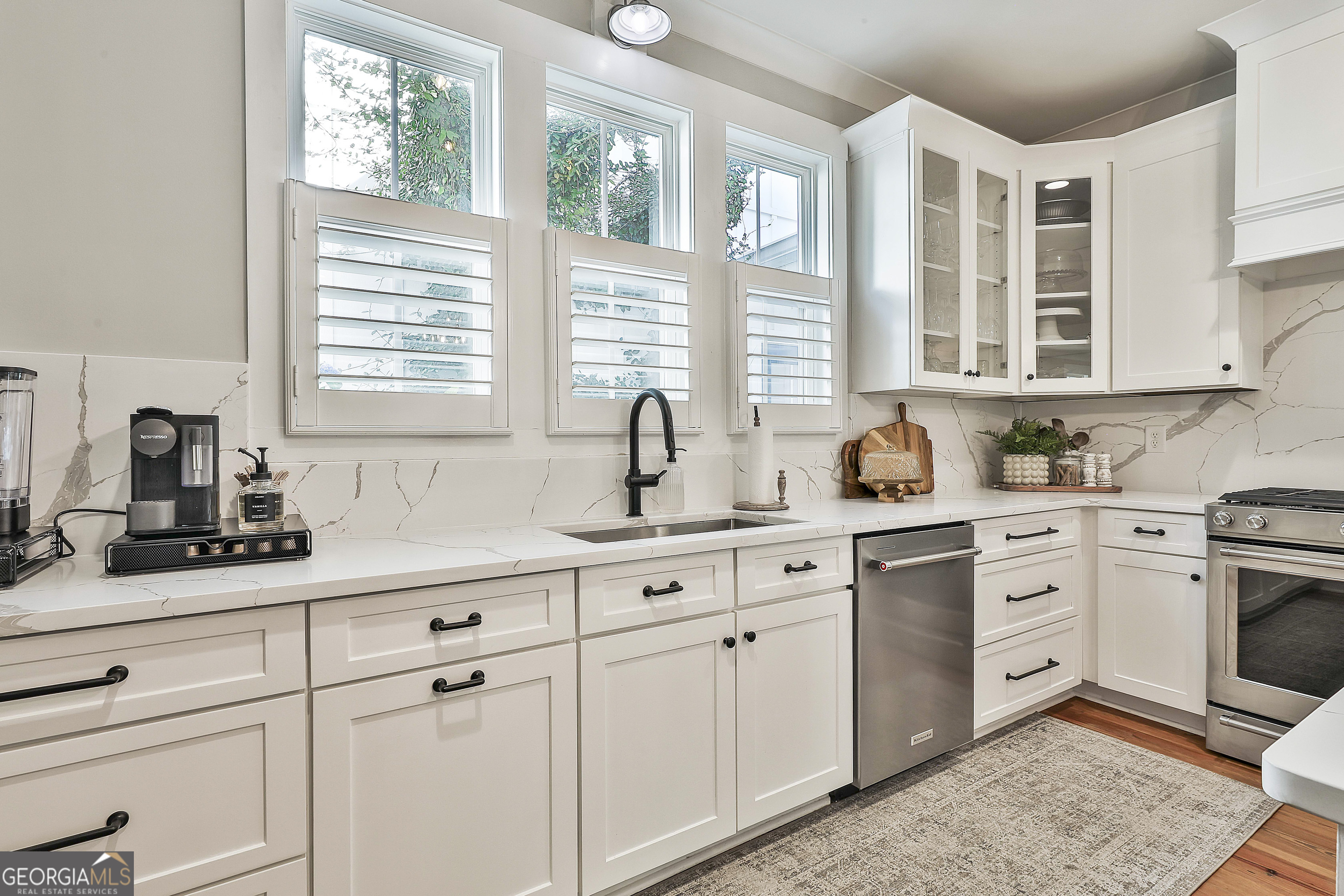49 Standing Rock Road Senoia, GA 30276 - Photo 37 of 92 a kitchen with stainless steel appliances white cabinets and a window