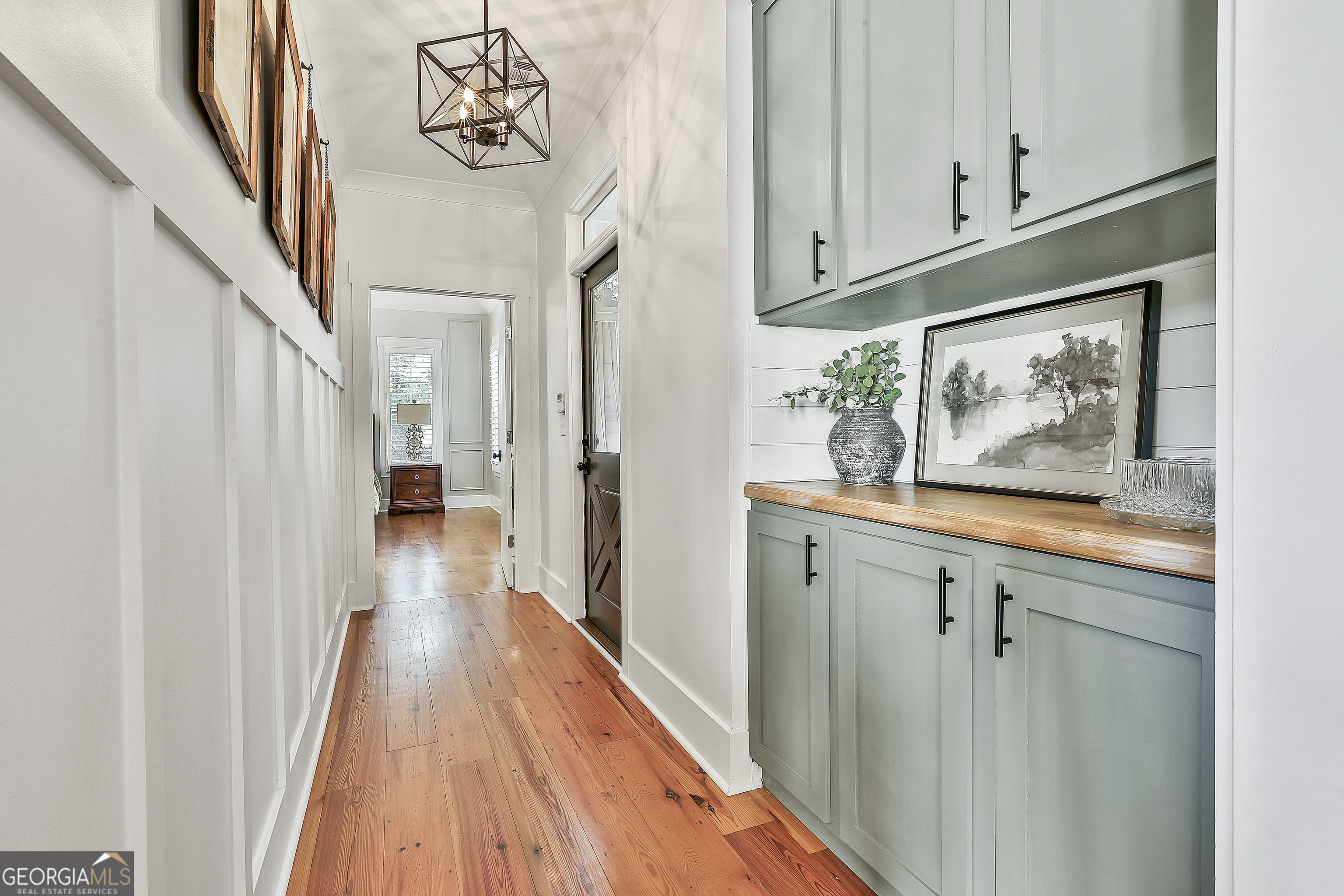 49 Standing Rock Road Senoia, GA 30276 - Photo 42 of 92 a view of a hallway with wooden floor and staircase