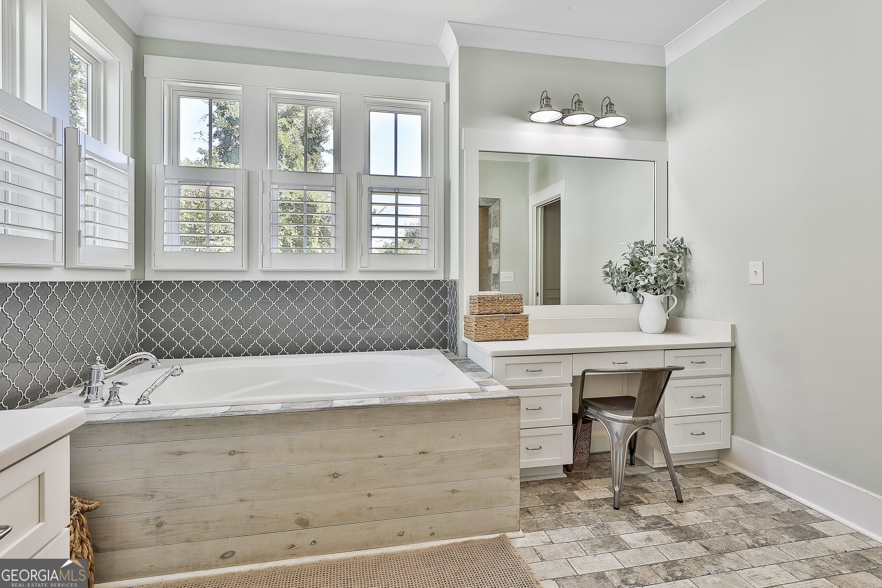 49 Standing Rock Road Senoia, GA 30276 - Photo 48 of 92 a spacious bathroom with a sink and a mirror