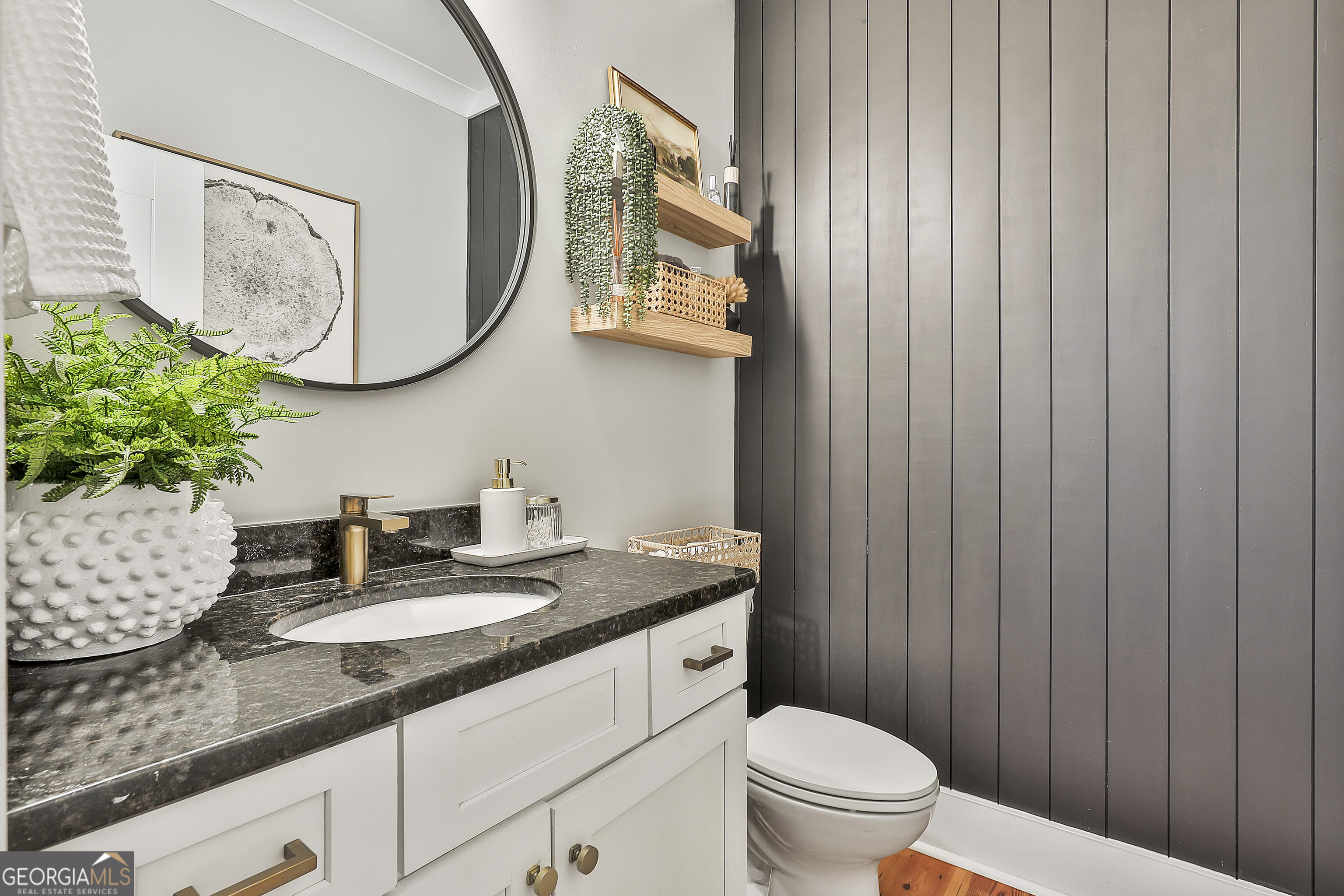 49 Standing Rock Road Senoia, GA 30276 - Photo 50 of 92 a bathroom with a granite countertop sink and a mirror