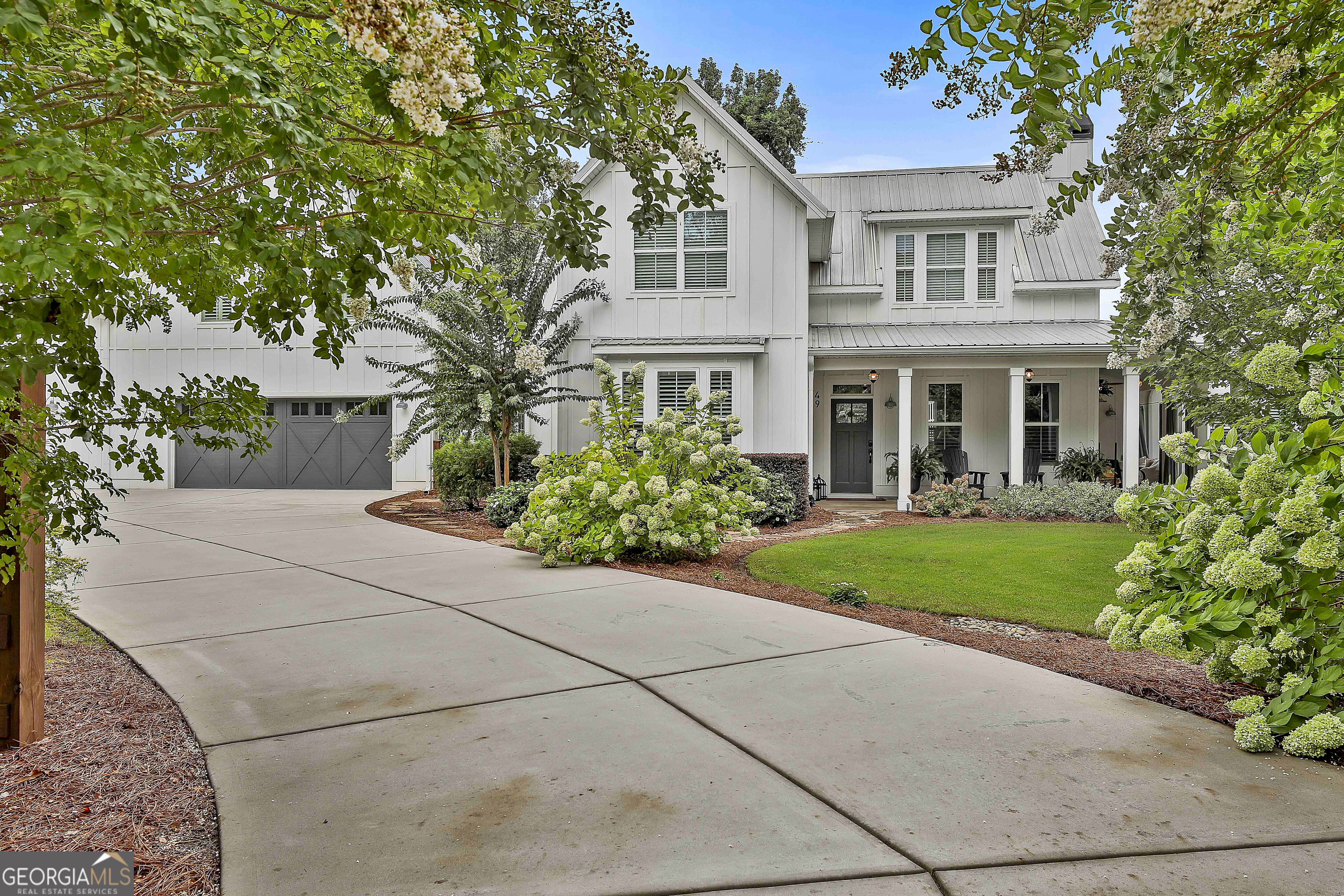49 Standing Rock Road Senoia, GA 30276 - Photo 5 of 92 a front view of a house with garden