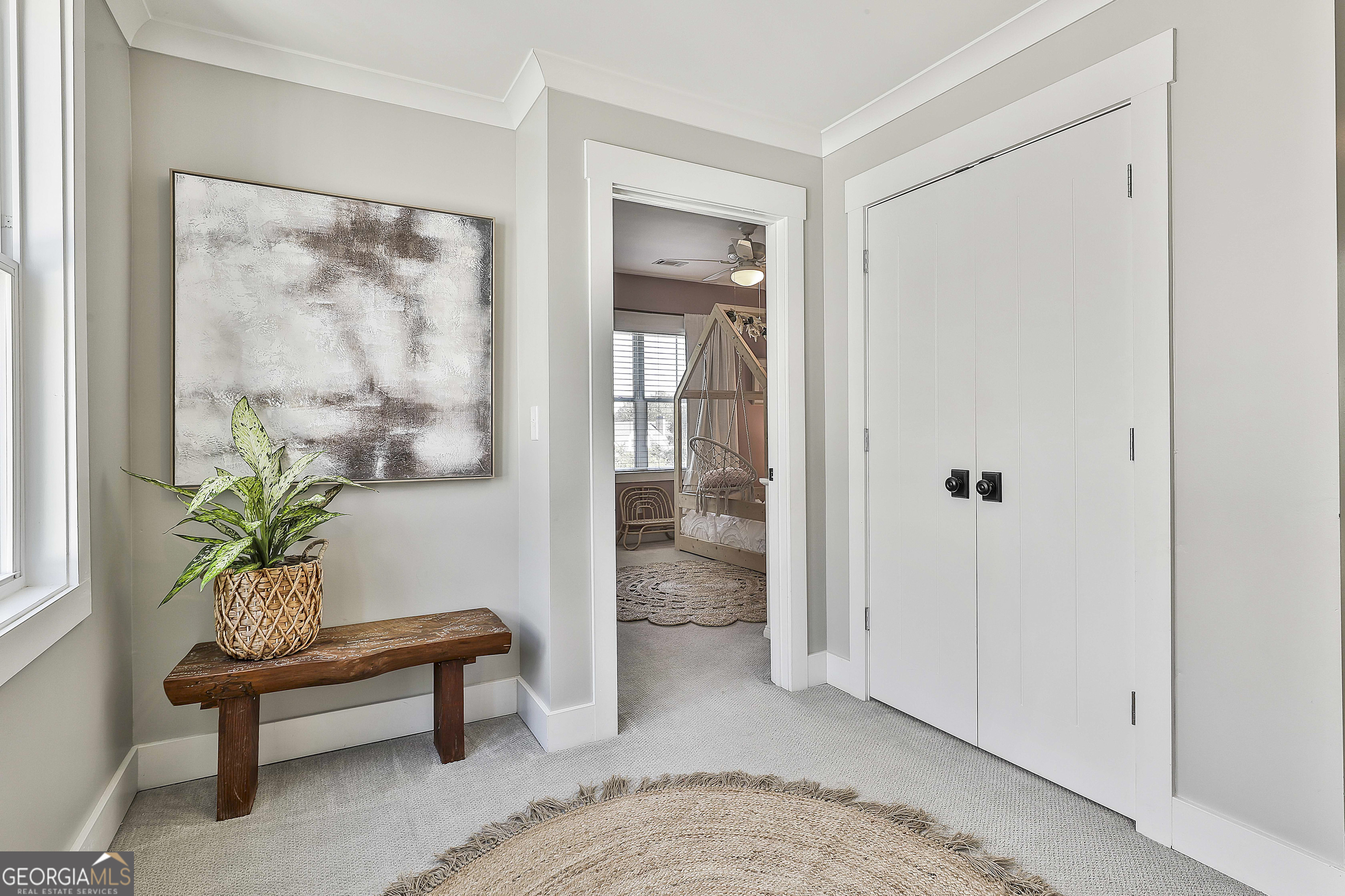 49 Standing Rock Road Senoia, GA 30276 - Photo 55 of 92 a living room with furniture and a potted plant