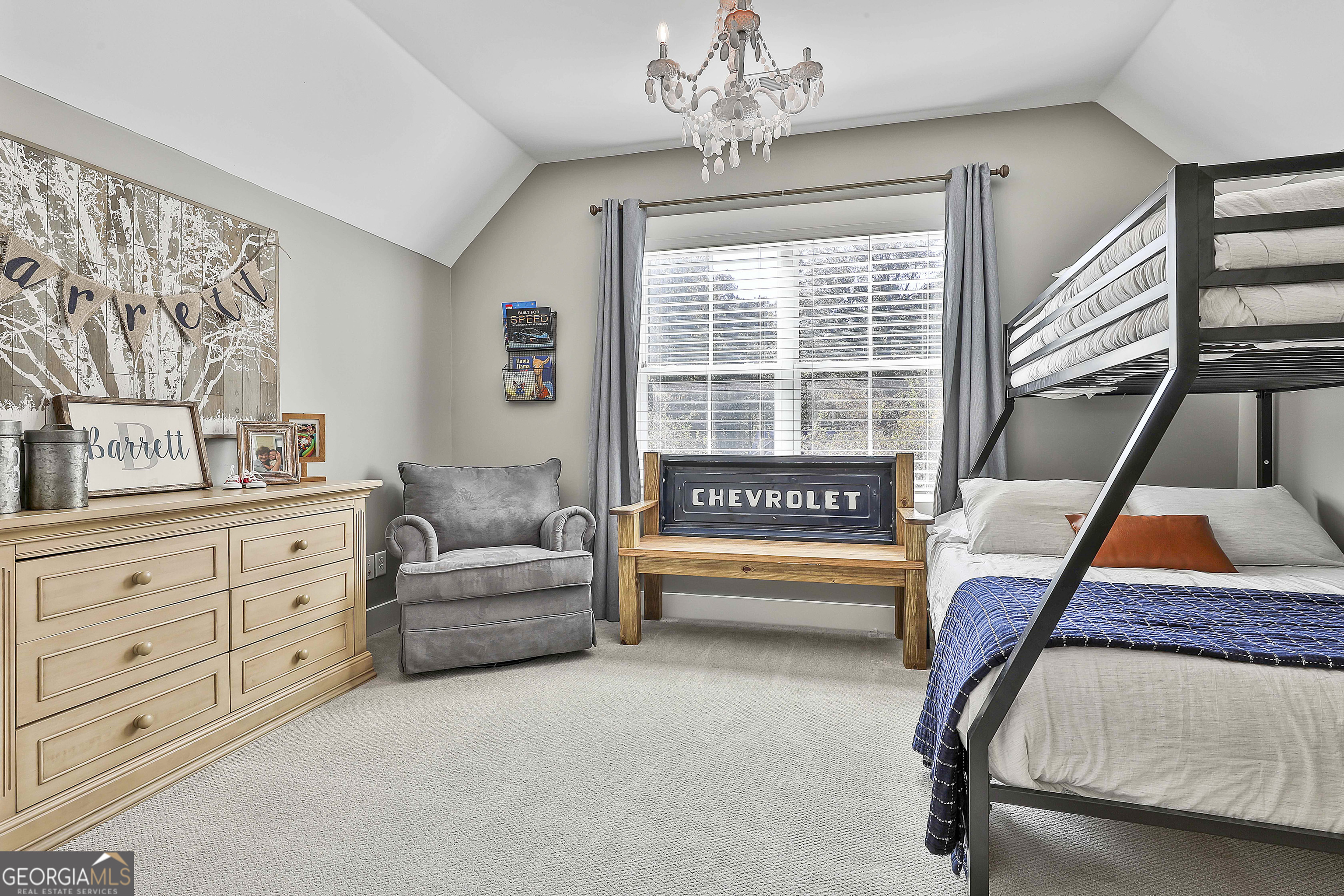 49 Standing Rock Road Senoia, GA 30276 - Photo 58 of 92 a living room with furniture and a chandelier