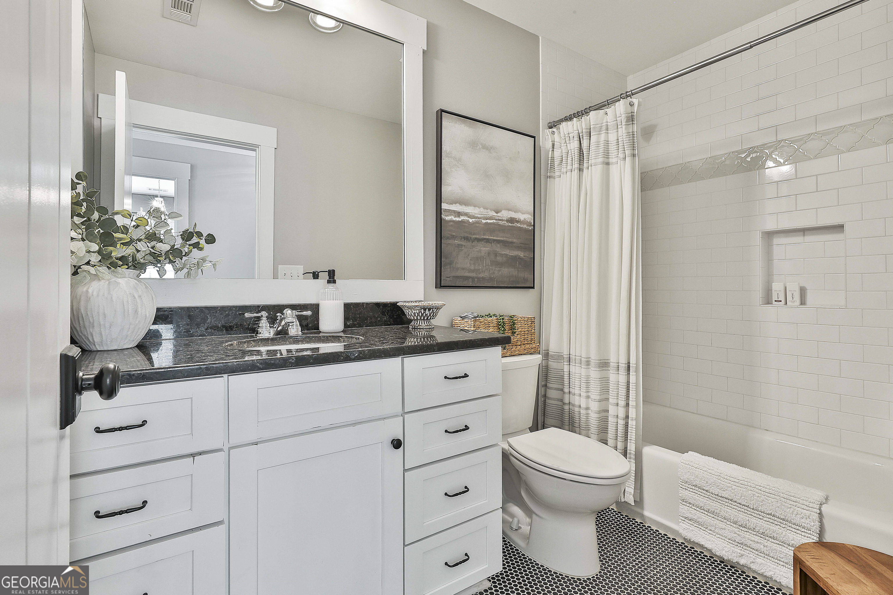 49 Standing Rock Road Senoia, GA 30276 - Photo 59 of 92 a bathroom with a granite countertop sink a toilet and shower