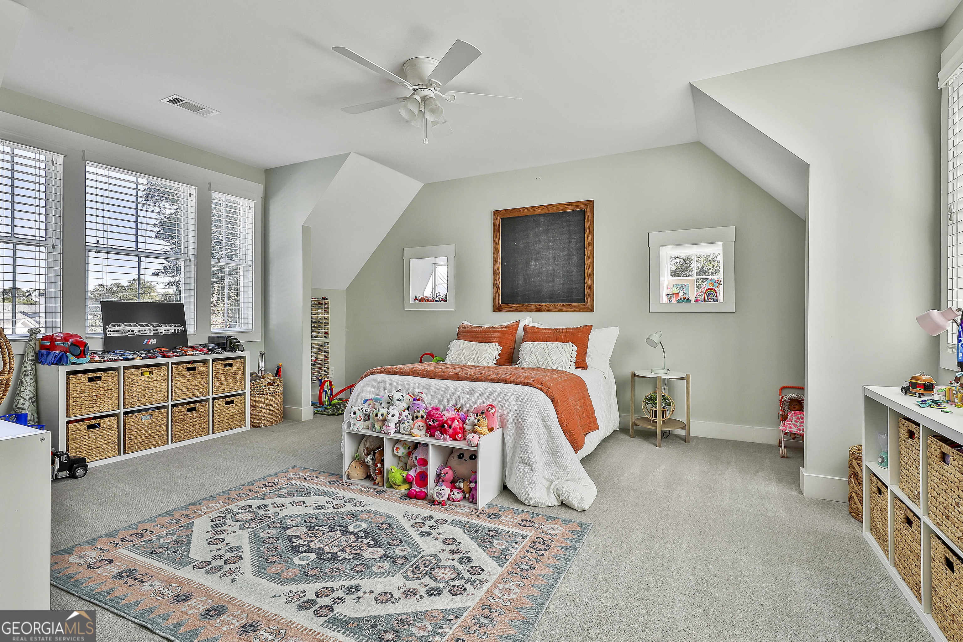 49 Standing Rock Road Senoia, GA 30276 - Photo 60 of 92 a bedroom with a bed a dresser and next to a window