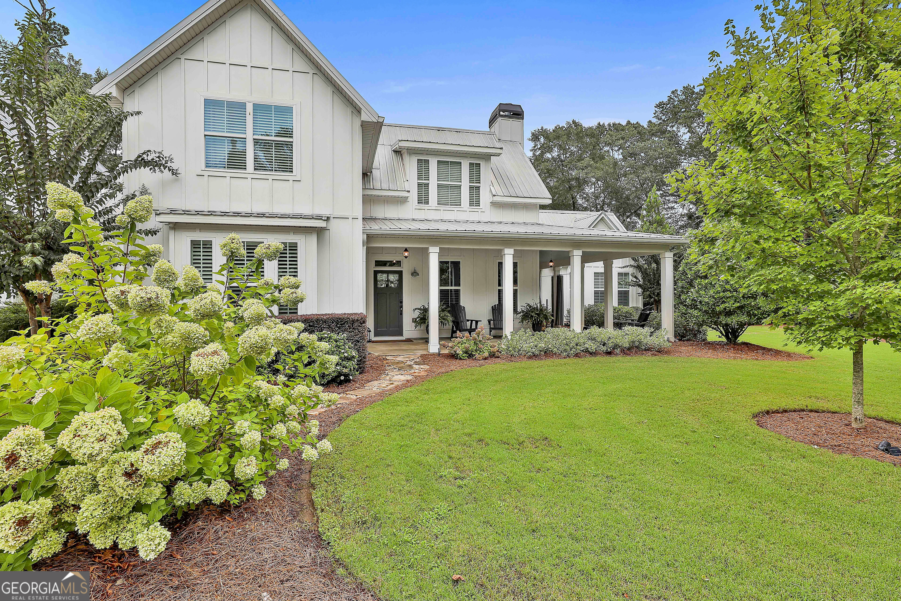 49 Standing Rock Road Senoia, GA 30276 - Photo 6 of 92 a front view of a house with a garden