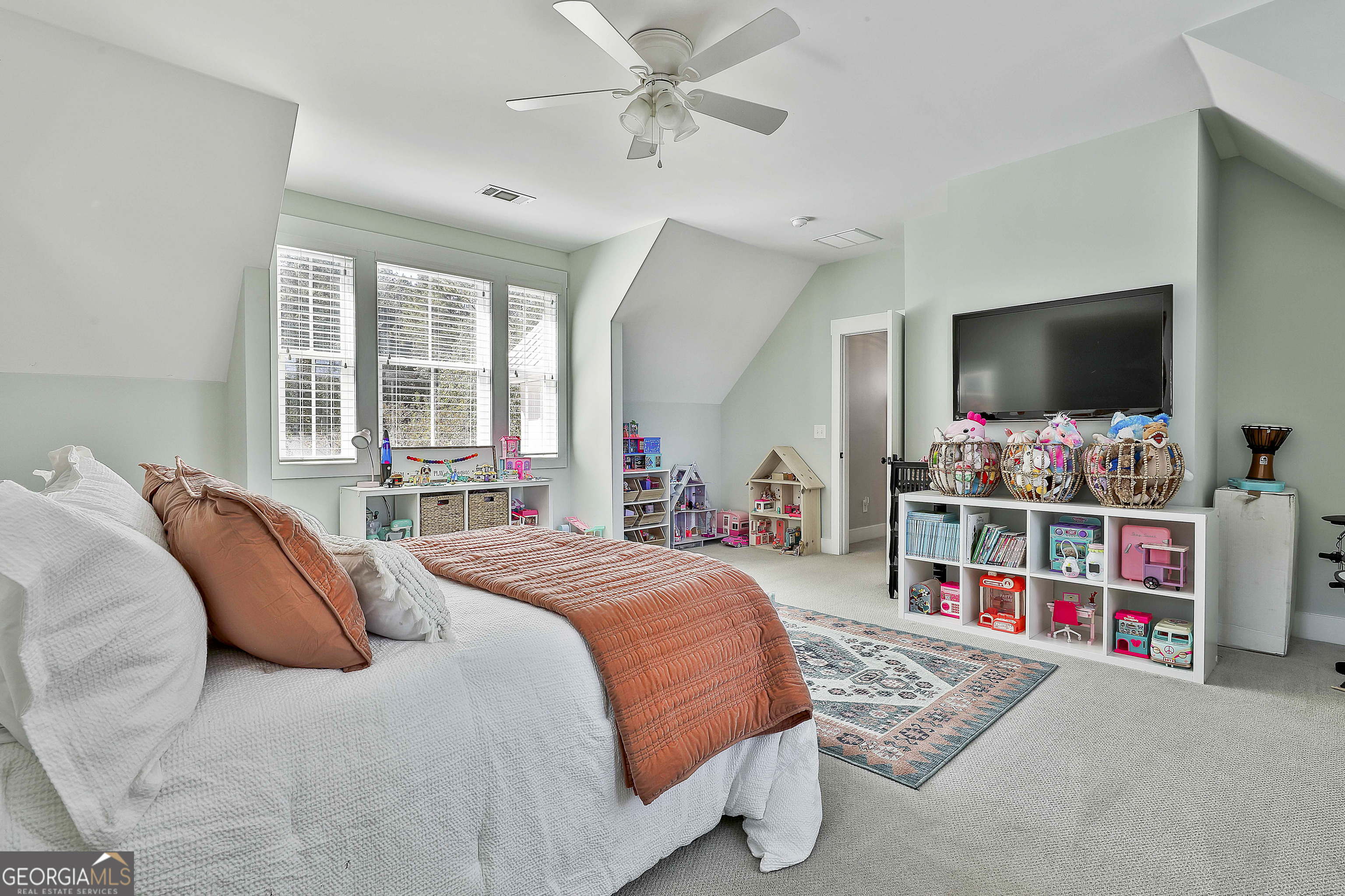 49 Standing Rock Road Senoia, GA 30276 - Photo 61 of 92 a bedroom with a bed and a flat screen tv