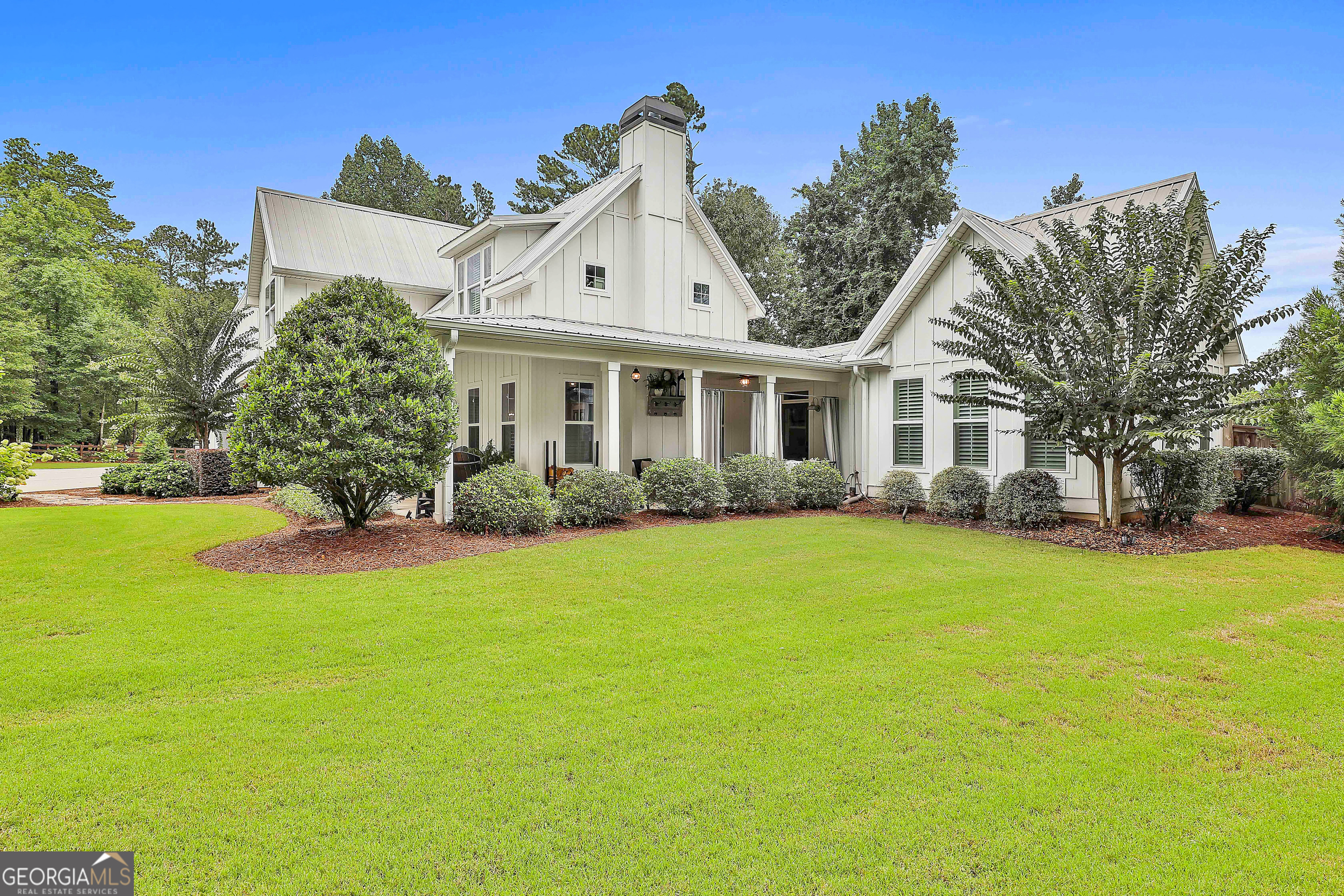 49 Standing Rock Road Senoia, GA 30276 - Photo 9 of 92 a front view of a house with a garden