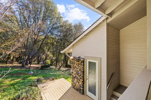 a en suite bathroom with a granite countertop sink and a mirror