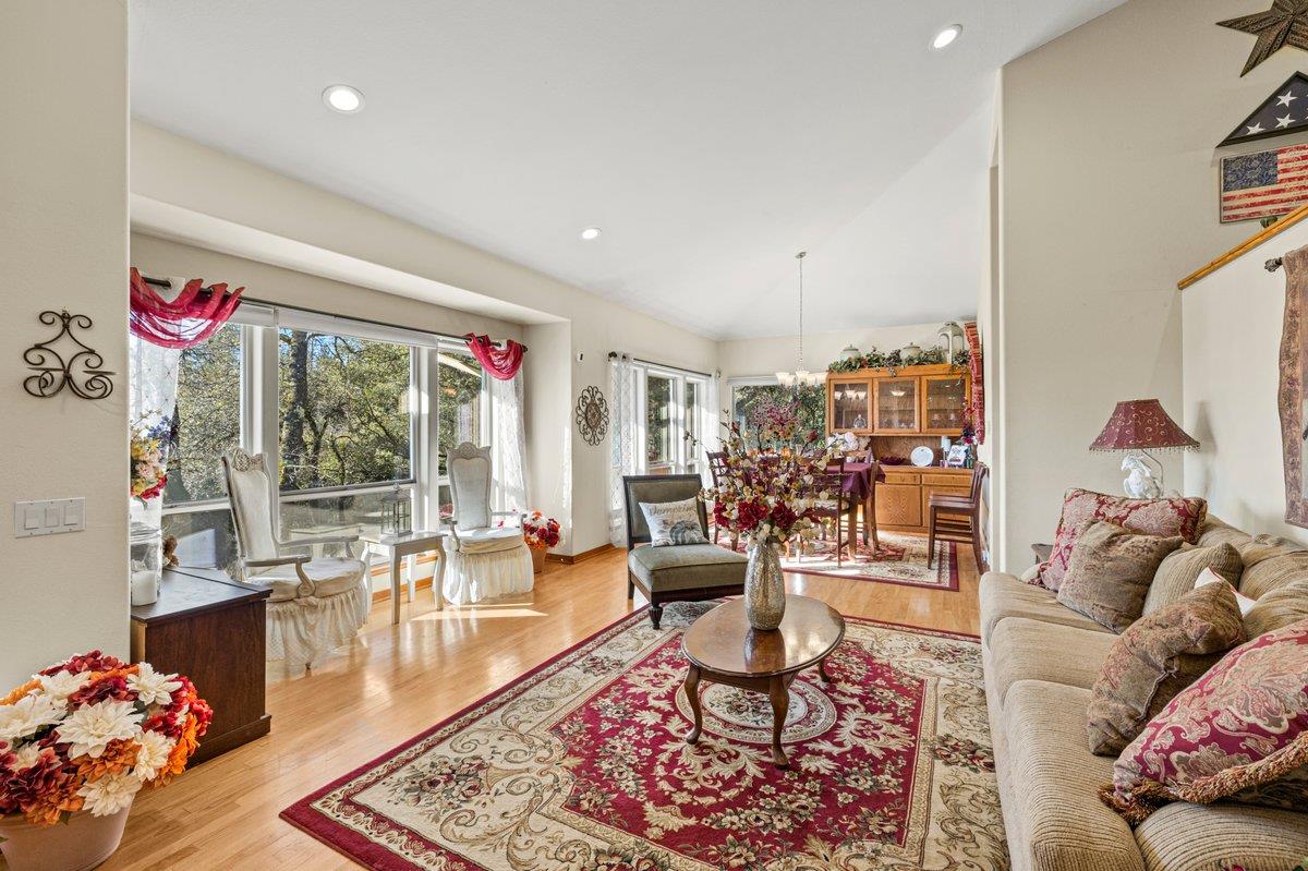 1144 Boole Road Applegate, CA 95703 - Photo 20 of 65 a living room filled with furniture and a floor to ceiling window