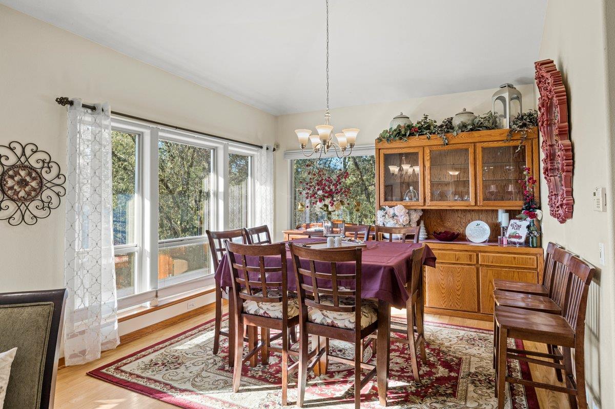 1144 Boole Road Applegate, CA 95703 - Photo 22 of 65 a view of a dining room with furniture window and wooden floor