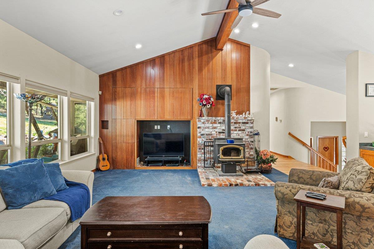 1144 Boole Road Applegate, CA 95703 - Photo 29 of 65 a living room with furniture flat screen tv and a fireplace