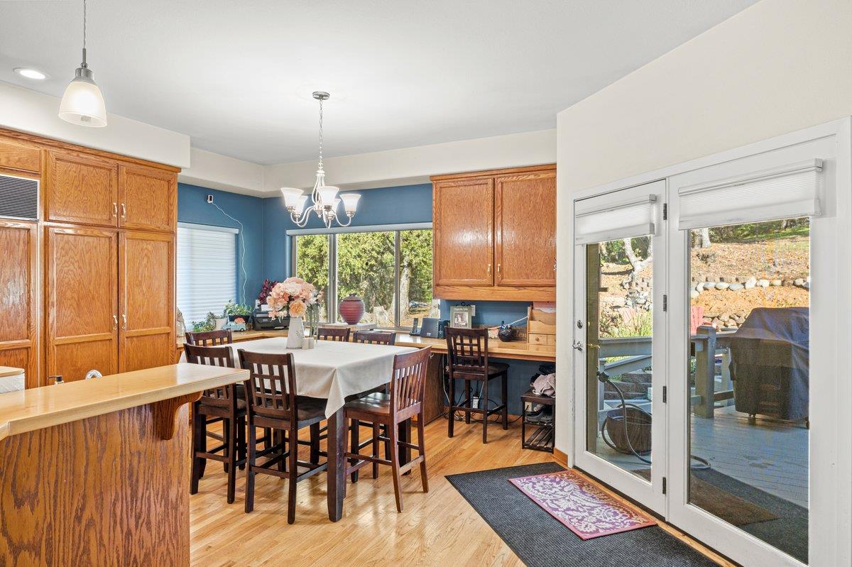 1144 Boole Road Applegate, CA 95703 - Photo 32 of 65 a view of a dining room with furniture window and wooden floor