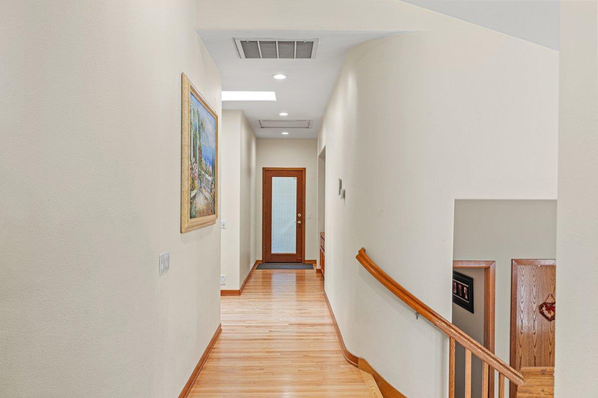 1144 Boole Road Applegate, CA 95703 - Photo 38 of 65 a view of a hallway with wooden floor and staircase