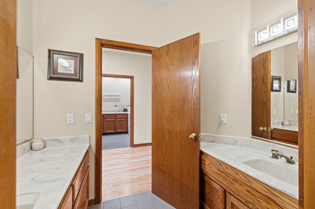 1144 Boole Road Applegate, CA 95703 - Photo 53 of 65 a en suite bathroom with a granite countertop sink and a mirror