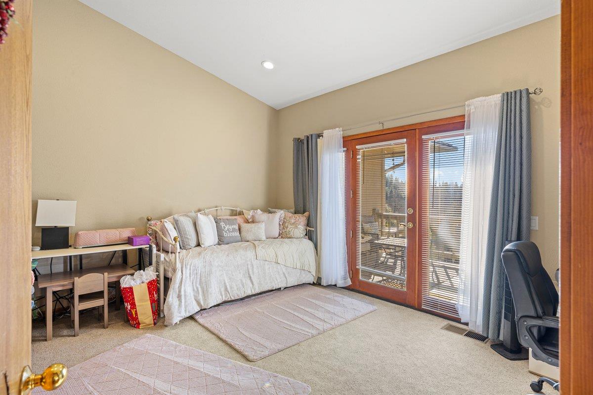1144 Boole Road Applegate, CA 95703 - Photo 54 of 65 a living room with furniture a large window and a walk in closet