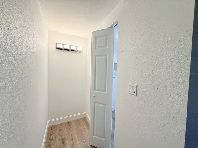 a view of livingroom with hardwood floor and closet