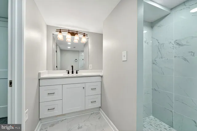 a bathroom with a double vanity sink and a mirror