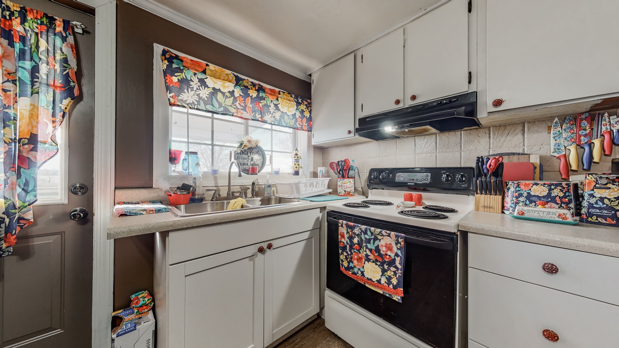 8 Layman Road Elora, TN 37328 - Photo 11 of 34 a kitchen with stainless steel appliances granite countertop a sink stove and cabinets