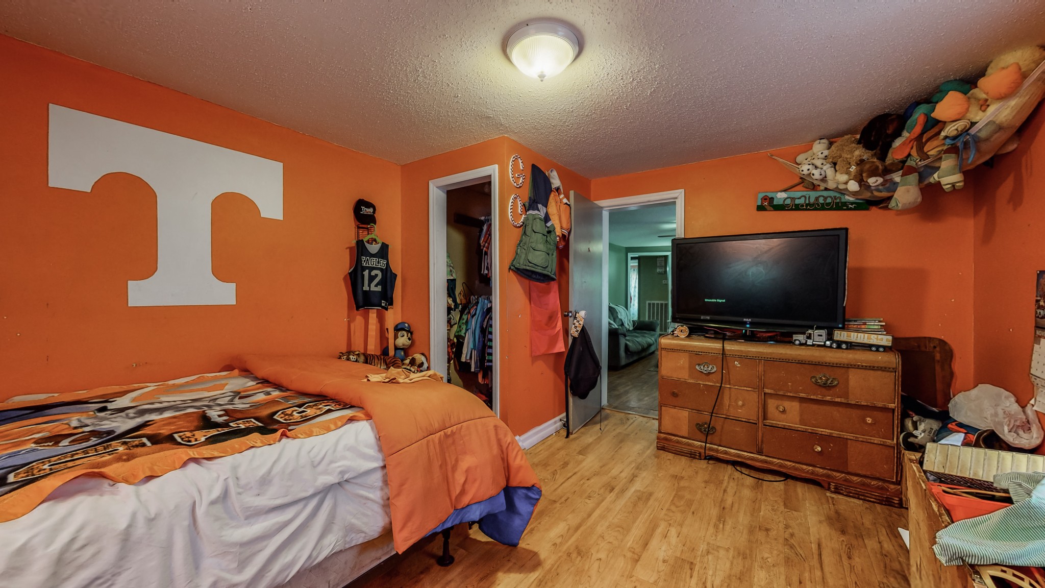 8 Layman Road Elora, TN 37328 - Photo 17 of 34 a bedroom with a bed and a flat screen tv
