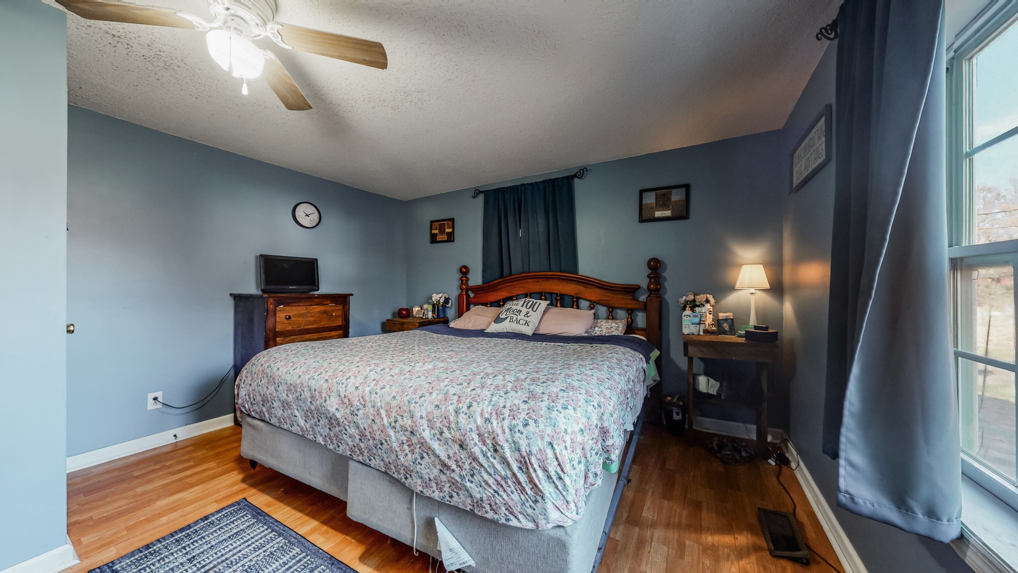 8 Layman Road Elora, TN 37328 - Photo 21 of 34 a bedroom with a bed and a chandelier