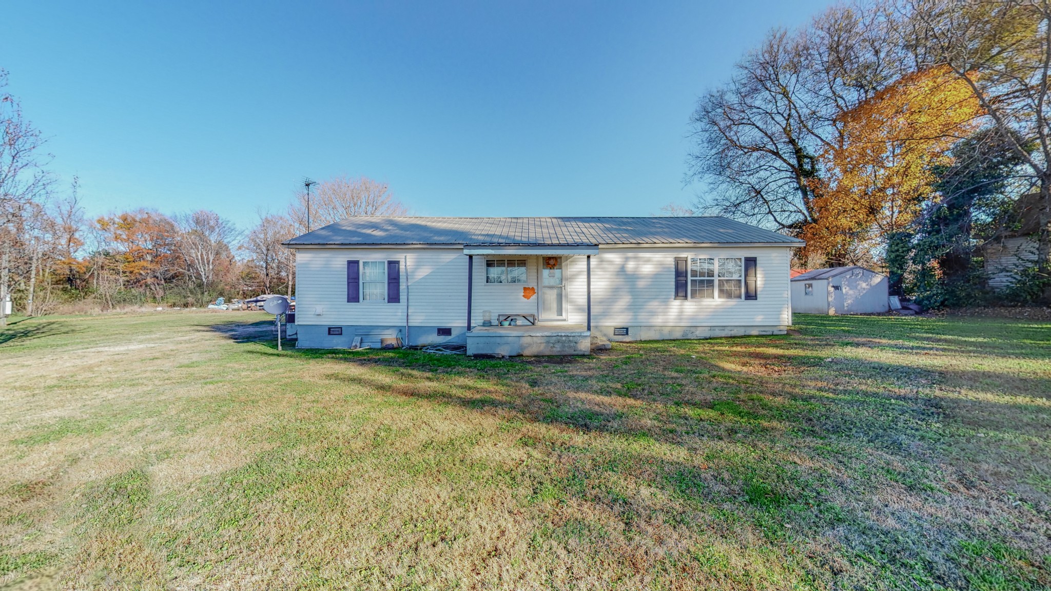 8 Layman Road Elora, TN 37328 - Photo 25 of 34 a view of a house with a backyard