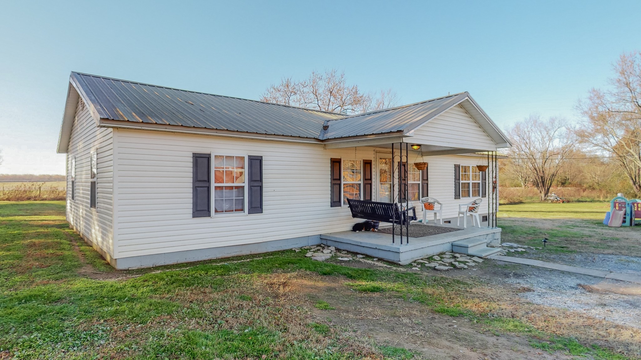 8 Layman Road Elora, TN 37328 - Photo 27 of 34 a view of a house with backyard porch and sitting area