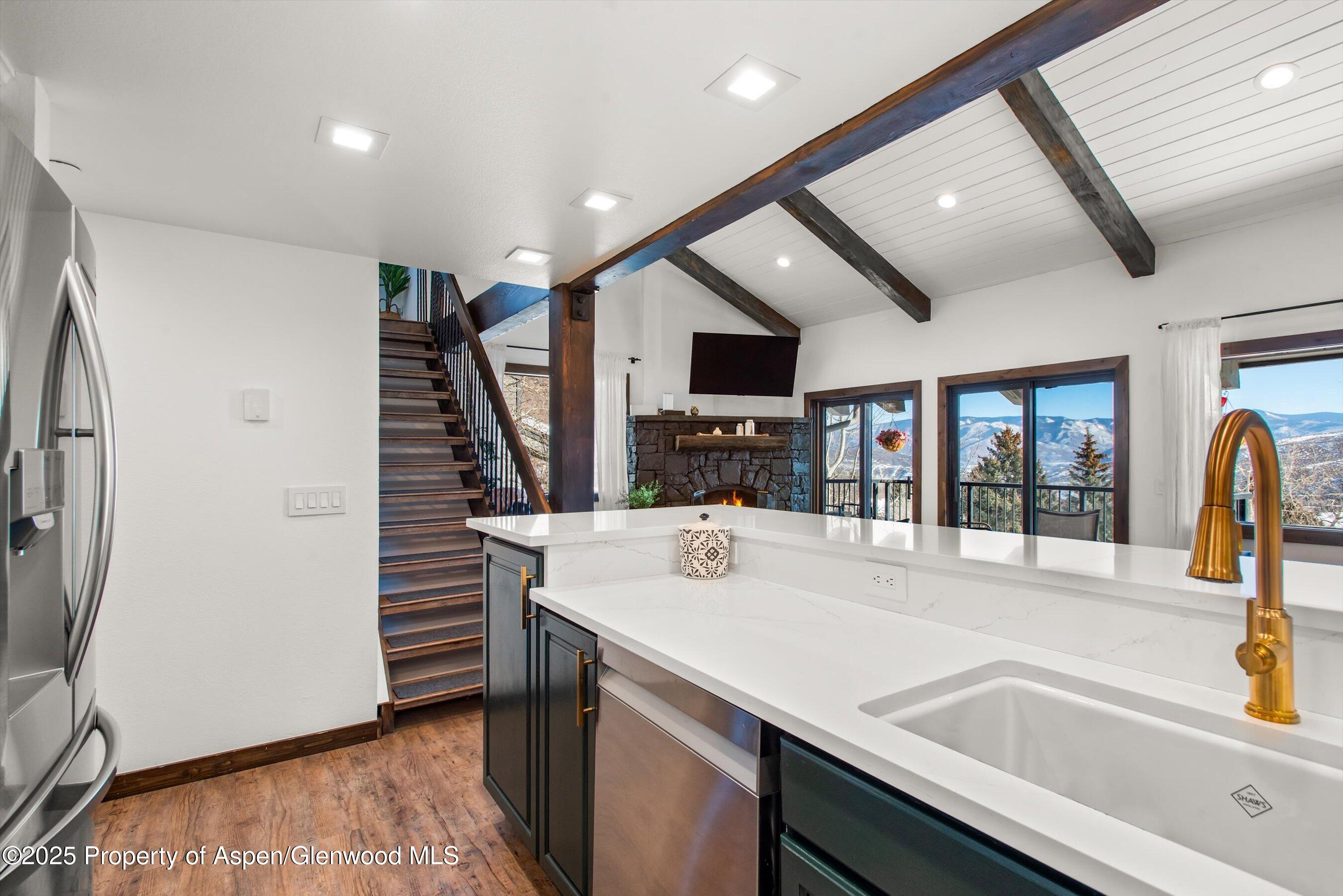 55 Upper Woodbridge Road, Unit J5 Snowmass Village, CO 81615 - Photo 12 of 32 a view of kitchen with sink and refrigerator