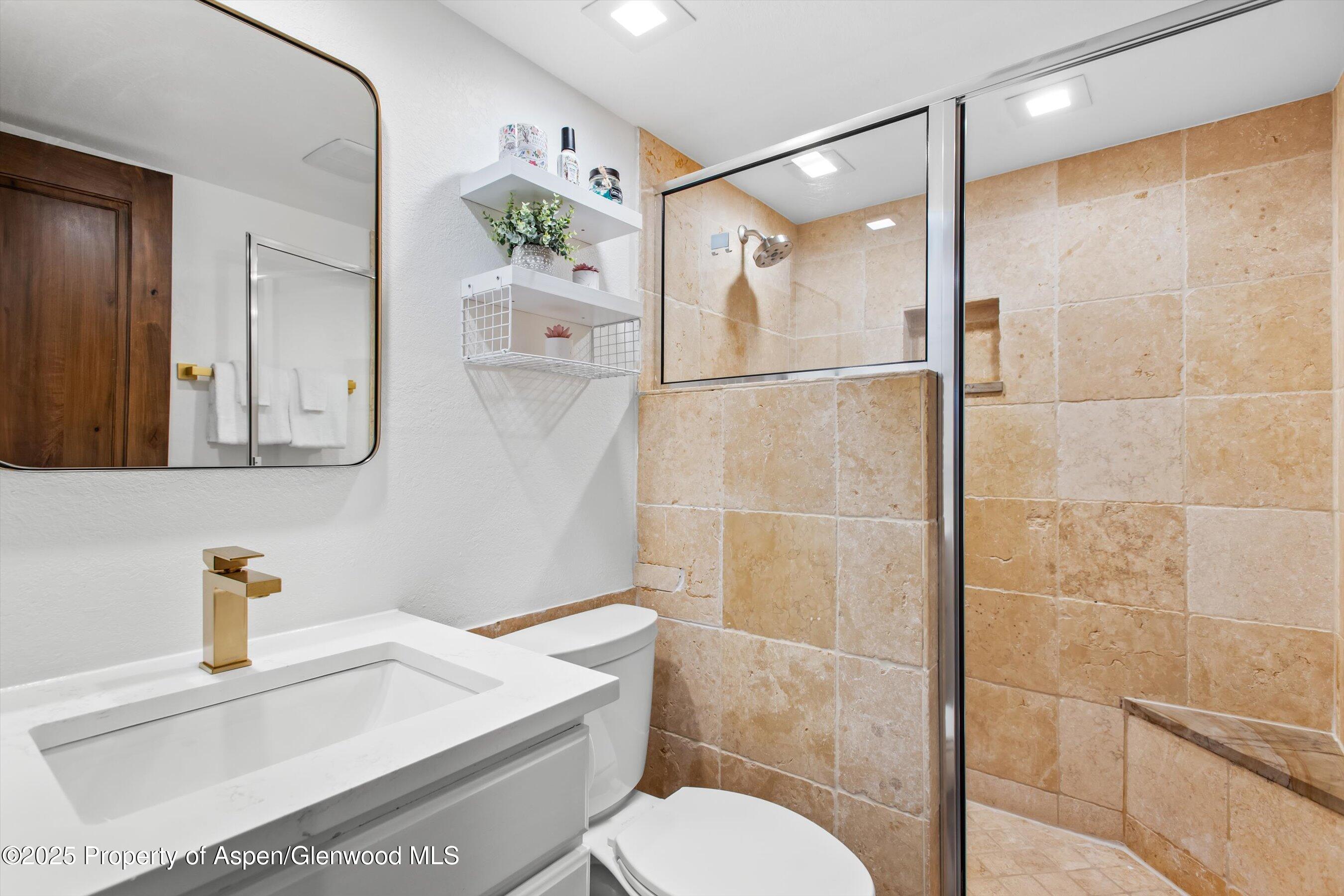 55 Upper Woodbridge Road, Unit J5 Snowmass Village, CO 81615 - Photo 20 of 32 a bathroom with a sink toilet and shower