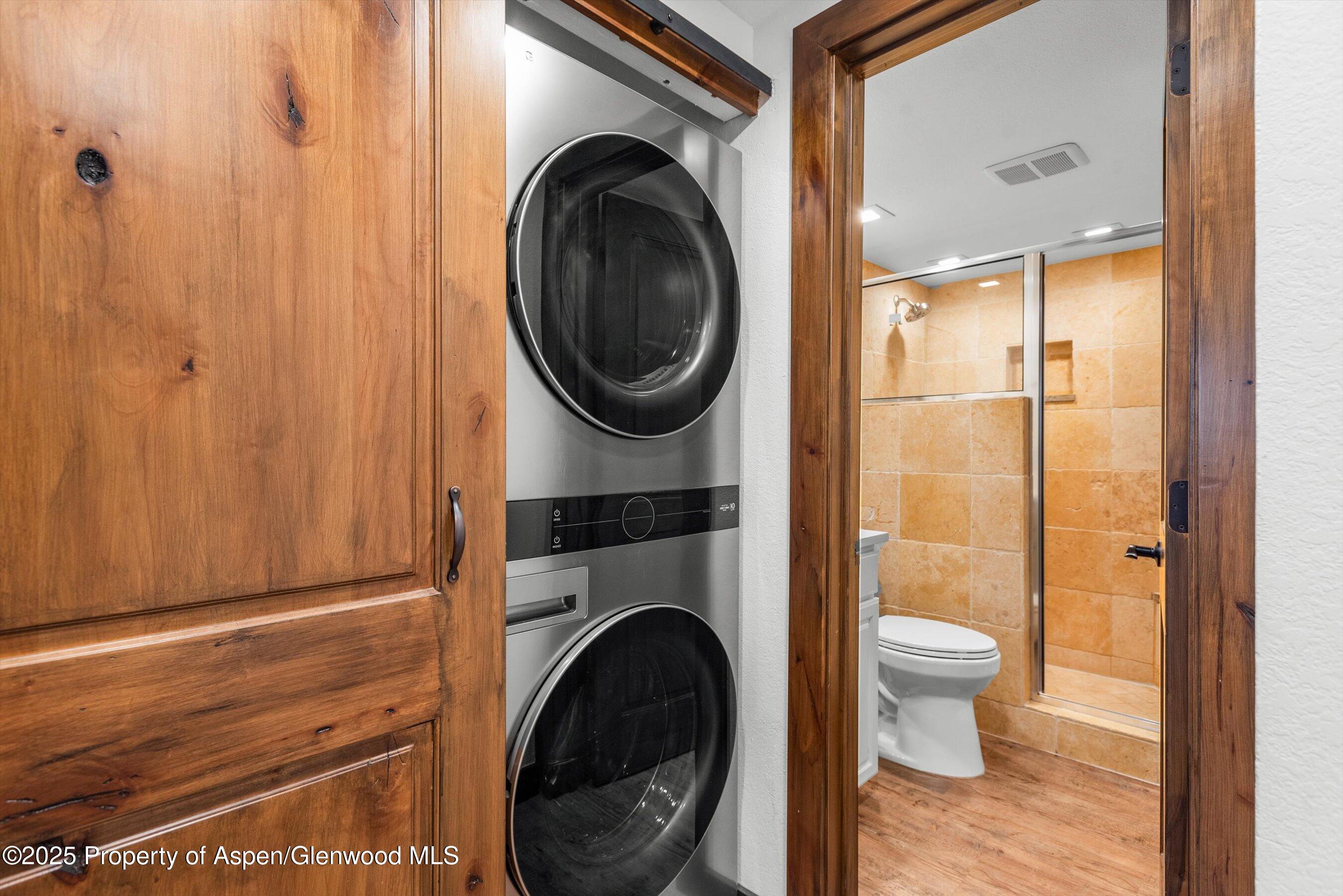 55 Upper Woodbridge Road, Unit J5 Snowmass Village, CO 81615 - Photo 21 of 32 a view of a hallway with washer and dryer