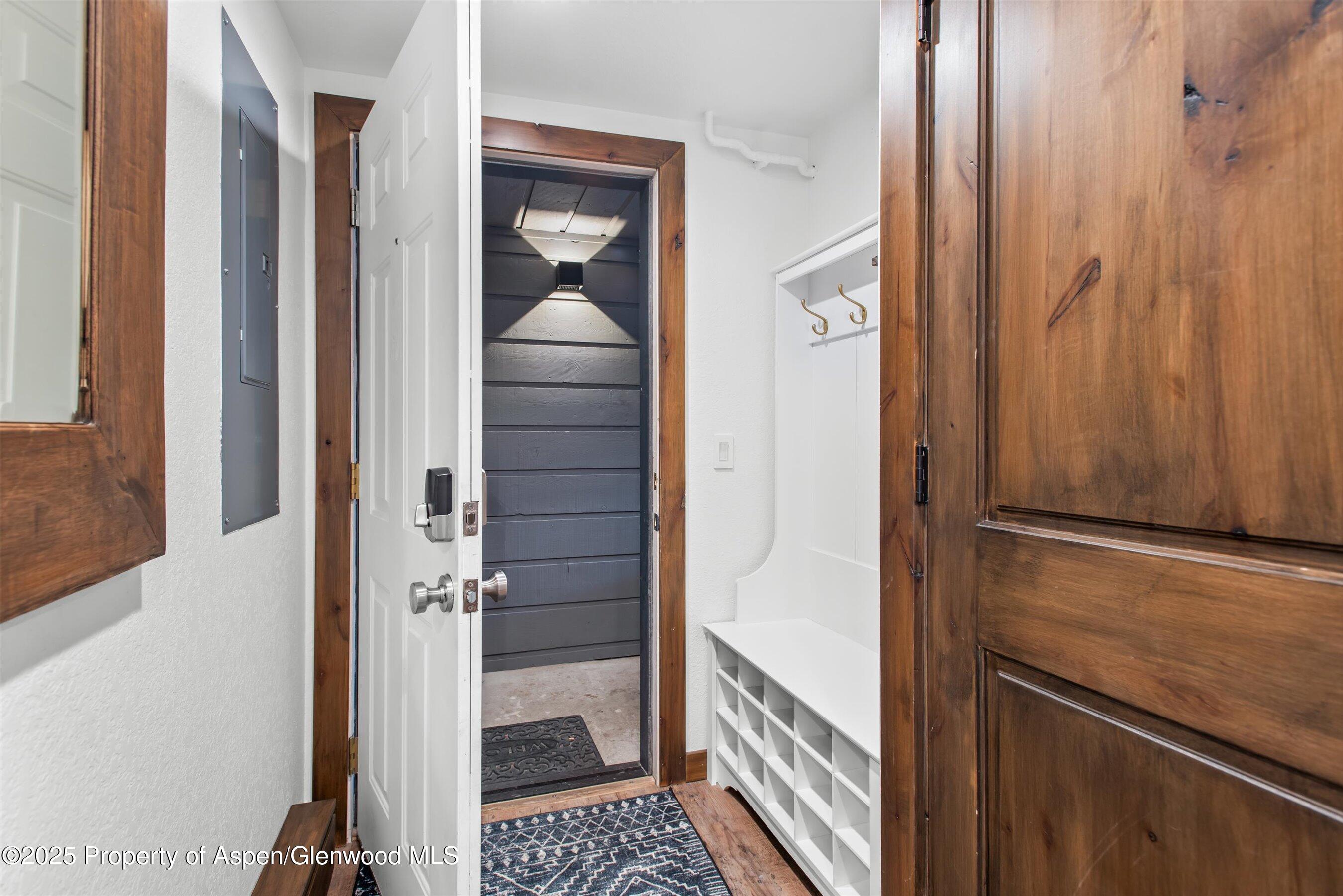 55 Upper Woodbridge Road, Unit J5 Snowmass Village, CO 81615 - Photo 22 of 32 a view of a hallway with wooden floor and staircase