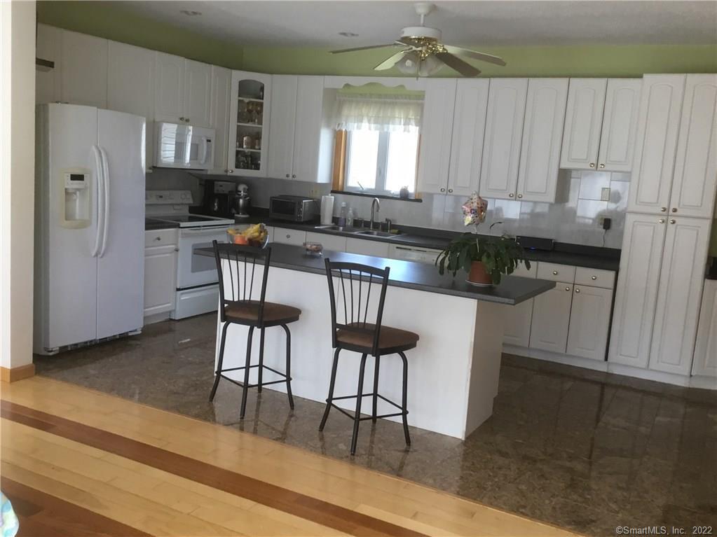 1683 Country Club Road Middletown, CT 06457 - Photo 1 of 1 a kitchen with stainless steel appliances granite countertop a stove a sink dishwasher and a refrigerator