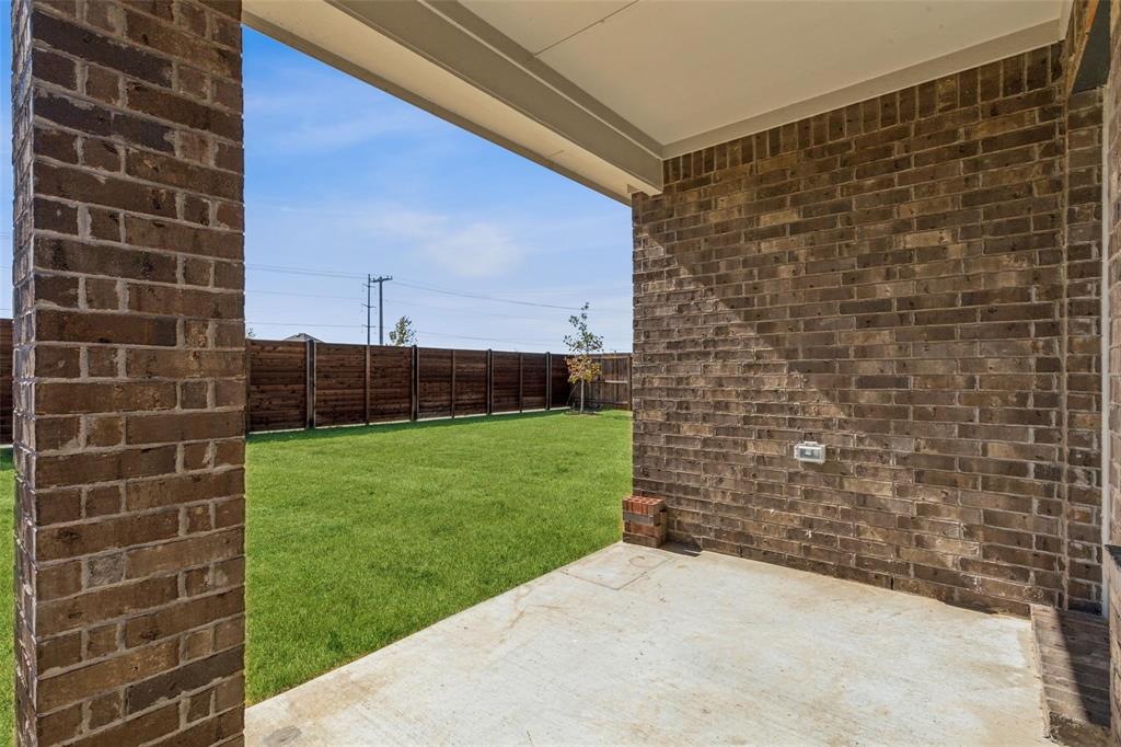 10314 Echo Brk Lane Aubrey, TX 76227 - Photo 14 of 21 Fenced backyard featuring a patio area