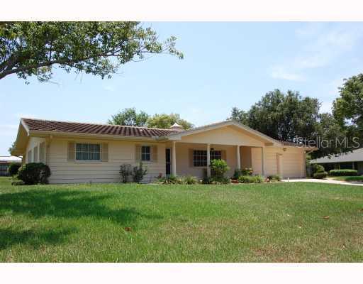1181 Robmar Road Dunedin, FL 34698 - Photo 1 of 1 a front view of a house with a garden