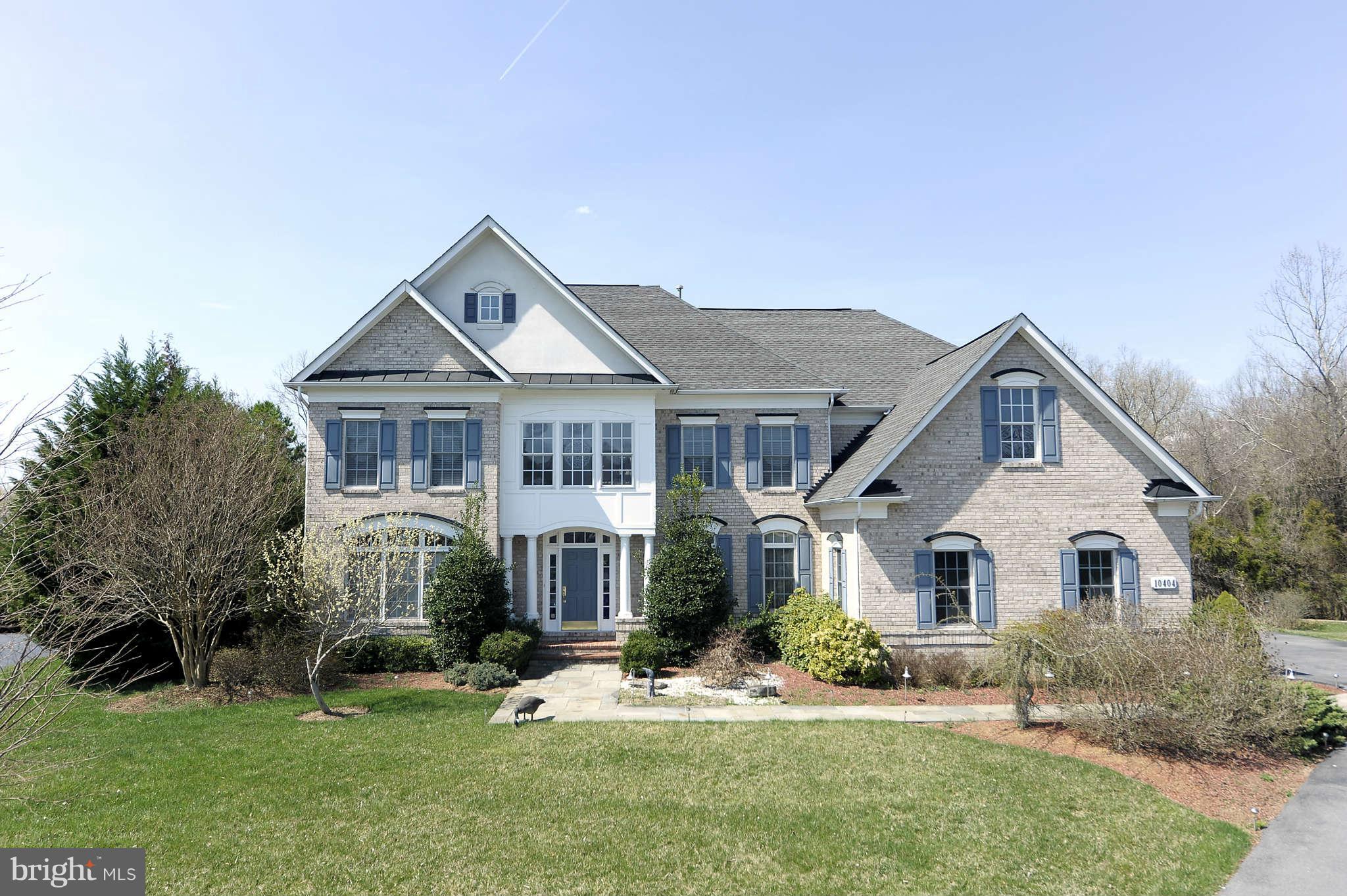 10404 Grey Fox Road Potomac, MD 20854 - Photo 1 of 30 a front view of a house with a yard