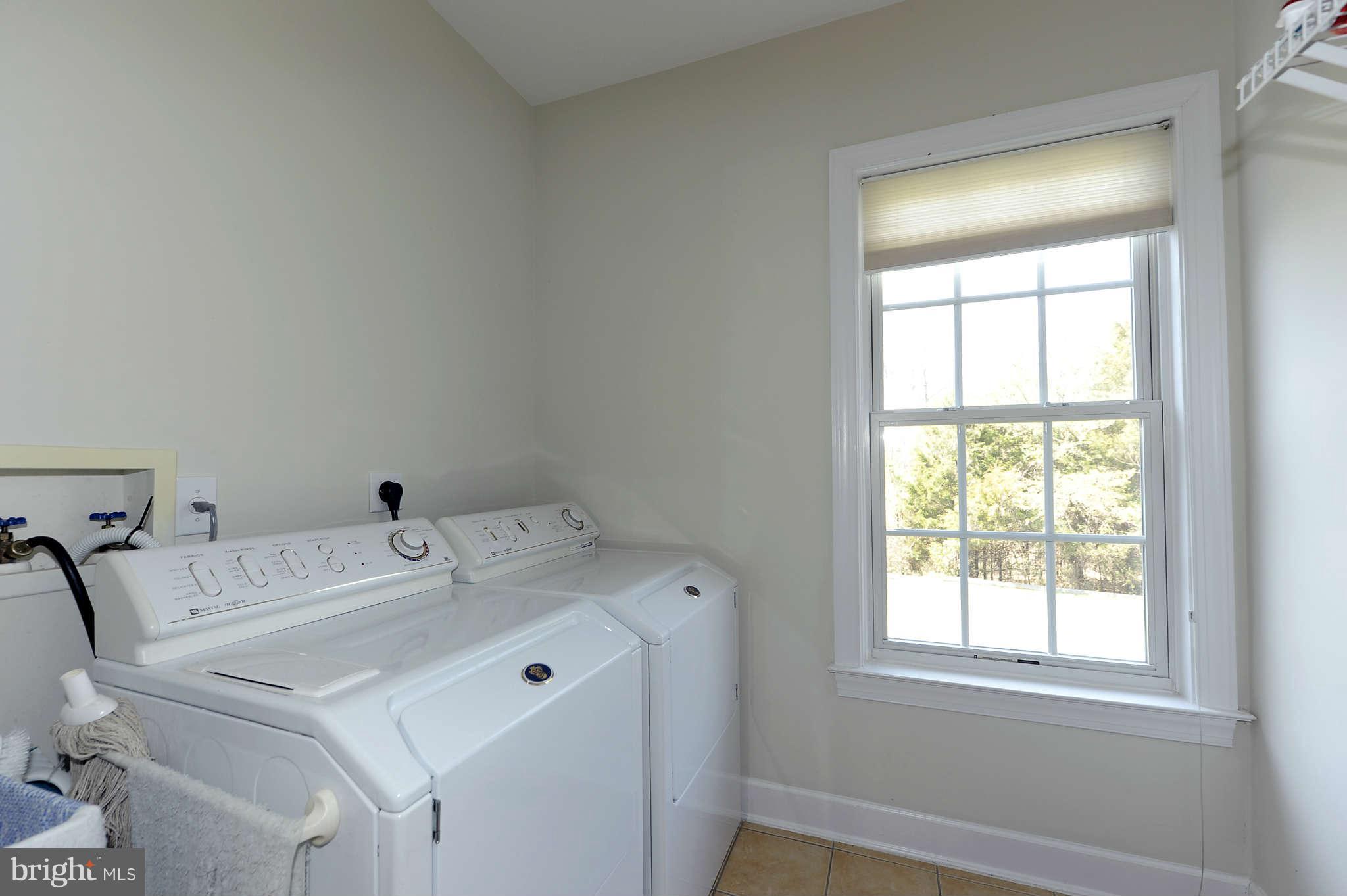 10404 Grey Fox Road Potomac, MD 20854 - Photo 13 of 30 a utility room with dryer and washer