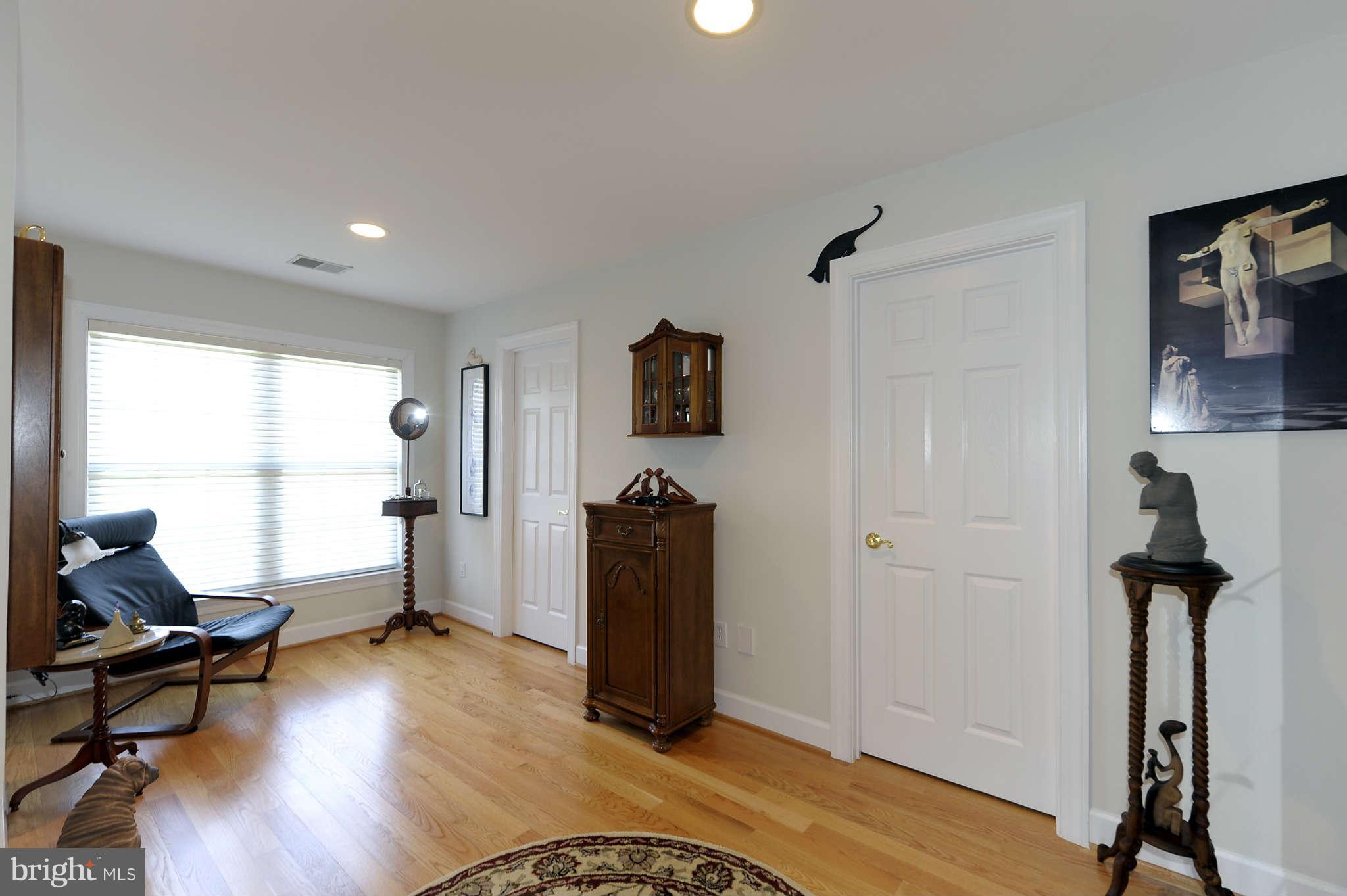 10404 Grey Fox Road Potomac, MD 20854 - Photo 16 of 30 a living room with furniture gym equipment and a window
