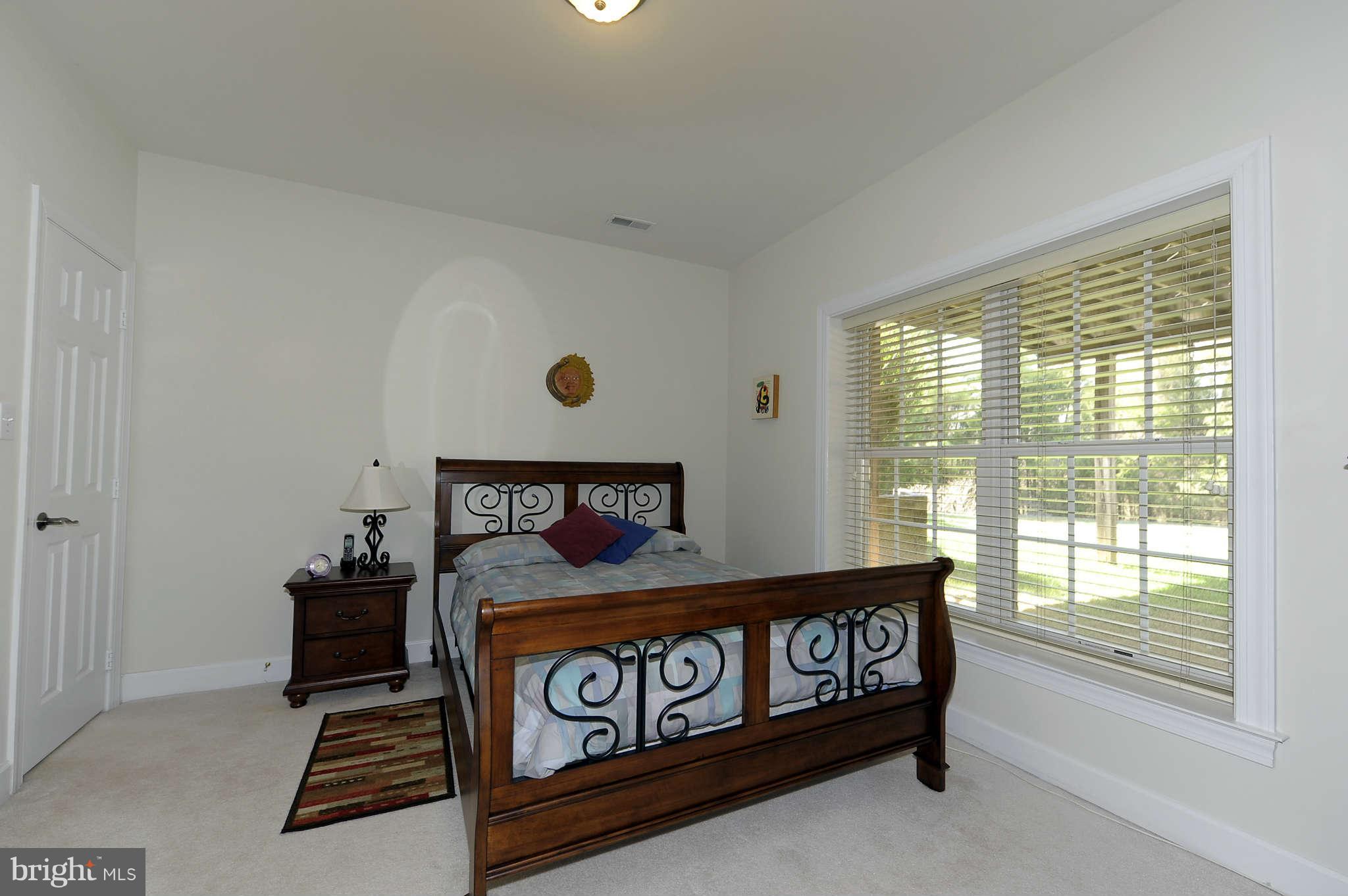 10404 Grey Fox Road Potomac, MD 20854 - Photo 21 of 30 a bedroom with a bed and a window