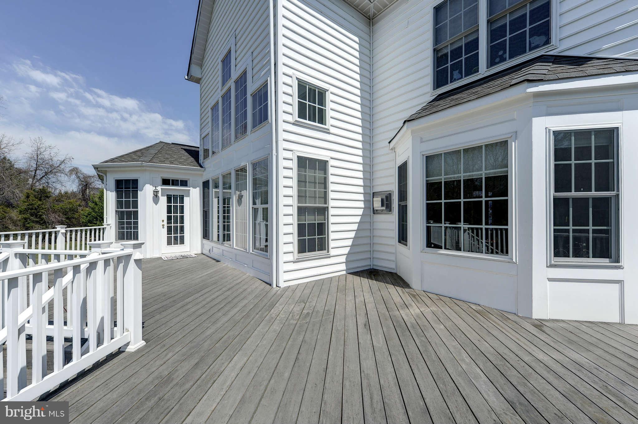 10404 Grey Fox Road Potomac, MD 20854 - Photo 27 of 30 a view of a house with a deck